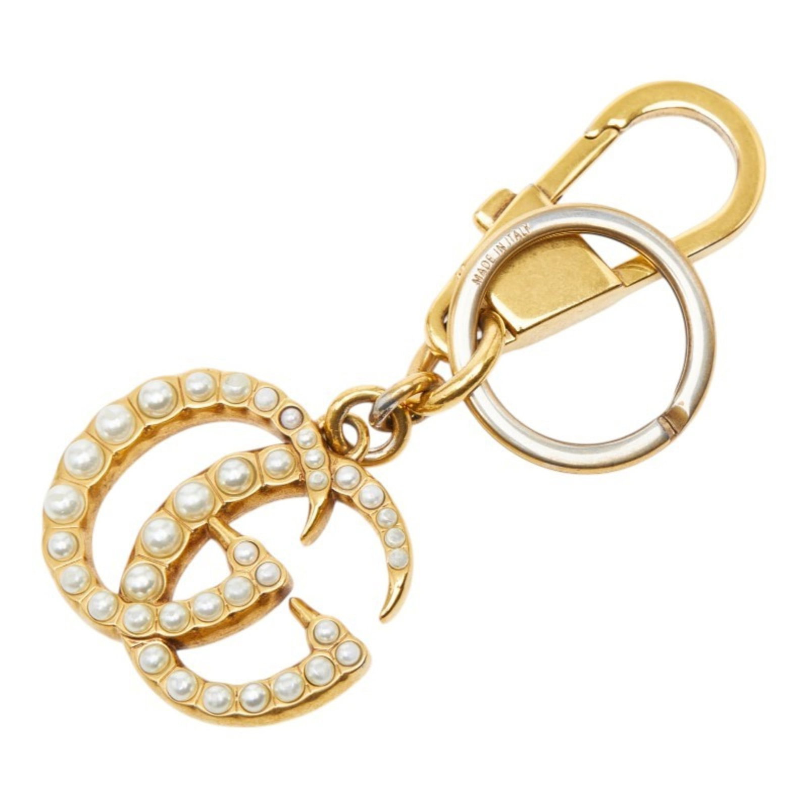 Keyring Gucci: Keyring Gucci Gold Gucci Keyring. A gold keyring bearing the iconic Gucci brand, adding a touch of luxury to everyday essentials. Its sleek design makes it a stylish accessory for anyone who appreciat