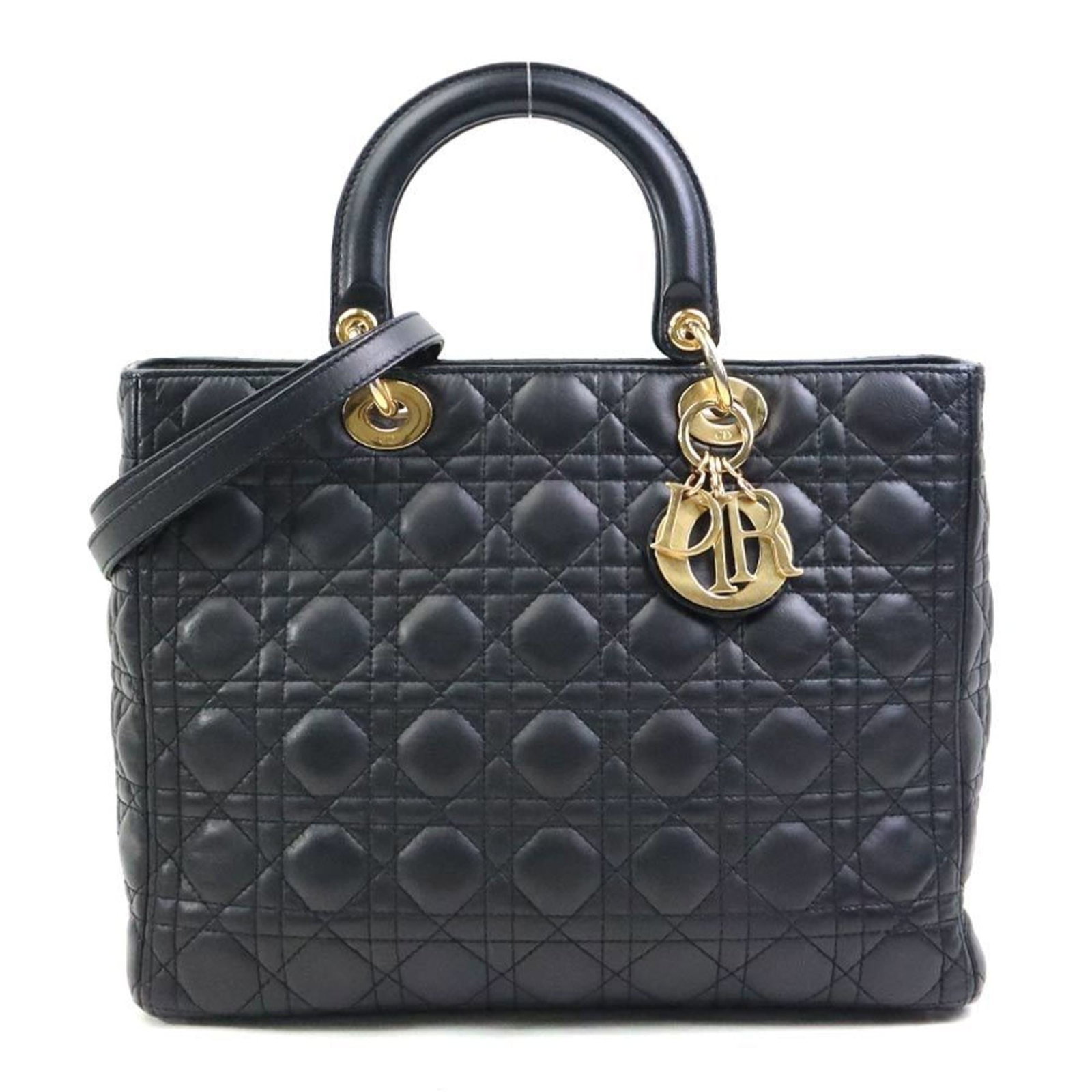 Handbag Christian Dior Leather Shoulder: Handbag Christian Dior Leather Shoulder This black leather shoulder bag from Christian Dior features a classic design with clean lines and a timeless silhouette. Made from high-quality leather, the ba