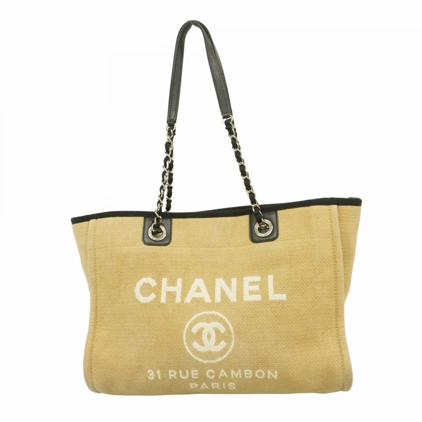 Canvas tote bag by Chanel: Canvas tote bag by Chanel Canvas tote bag by Chanel, featuring high-quality beige canvas material and silver hardware, measures 28cm x 34cm x 16cm. This stylish tote boasts a classic design with clean