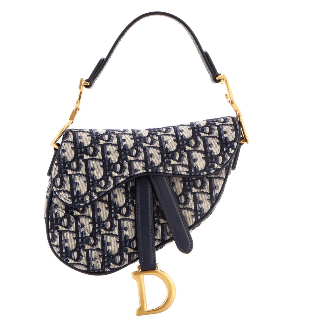 Canvas mini handbag saddle Oblique Christian Dior: Canvas mini handbag saddle Oblique Christian Dior Canvas mini handbag saddle Oblique Christian Dior features a striking blue canvas exterior with neutral interior, adorned with aged gold hardware. The