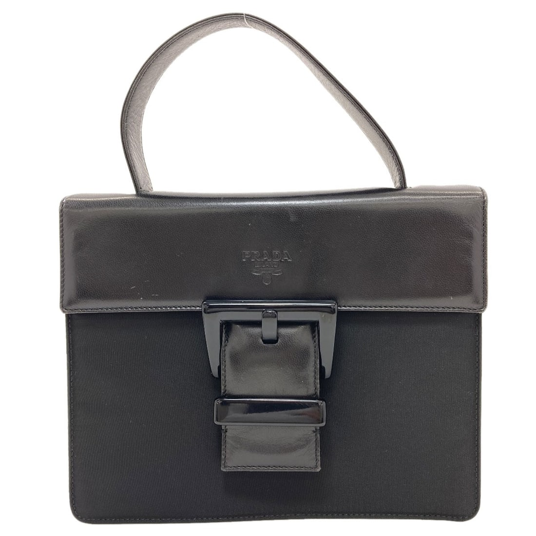 Prada B7128 Belt Motif Handbag Nylon Leather: Prada B7128 Belt Motif Handbag Nylon Leather Black Prada B7128 Belt Motif Handbag made from Nylon Leather. This handbag features a distinctive belt motif design, showcasing the brand's signature style