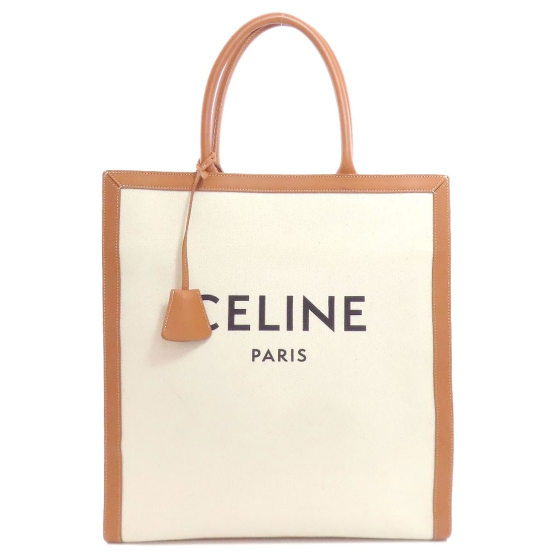 Canvas tote bag large vertical cover Celine: Canvas tote bag large vertical cover Celine White canvas tote bag with large vertical cover from CELINE, featuring a simple and elegant design. Made from high-quality canvas material, this bag offers