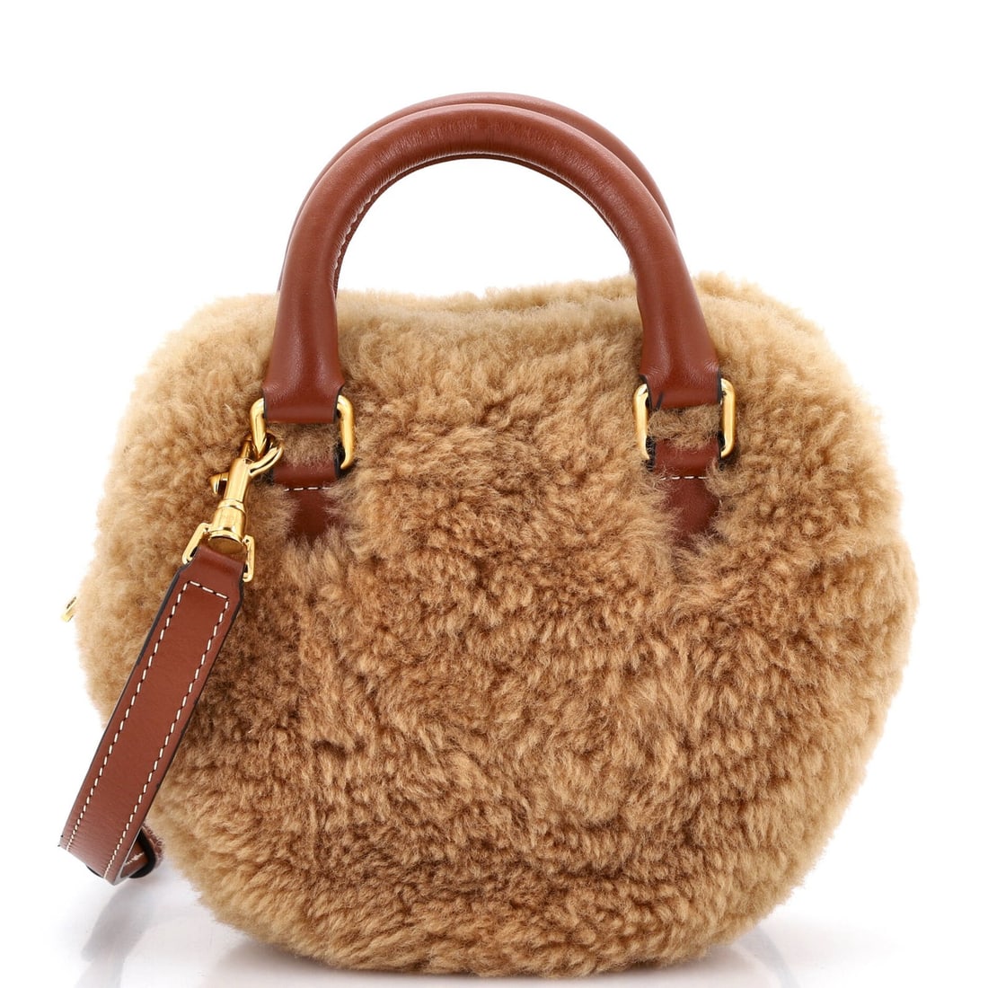 Shearling medium leather bag celine heart: Shearling medium leather bag celine heart Shearling medium leather bag from Celine, featuring a classic heart design. This stylish shoulder bag boasts a rich brown shearling exterior with gold hardwar