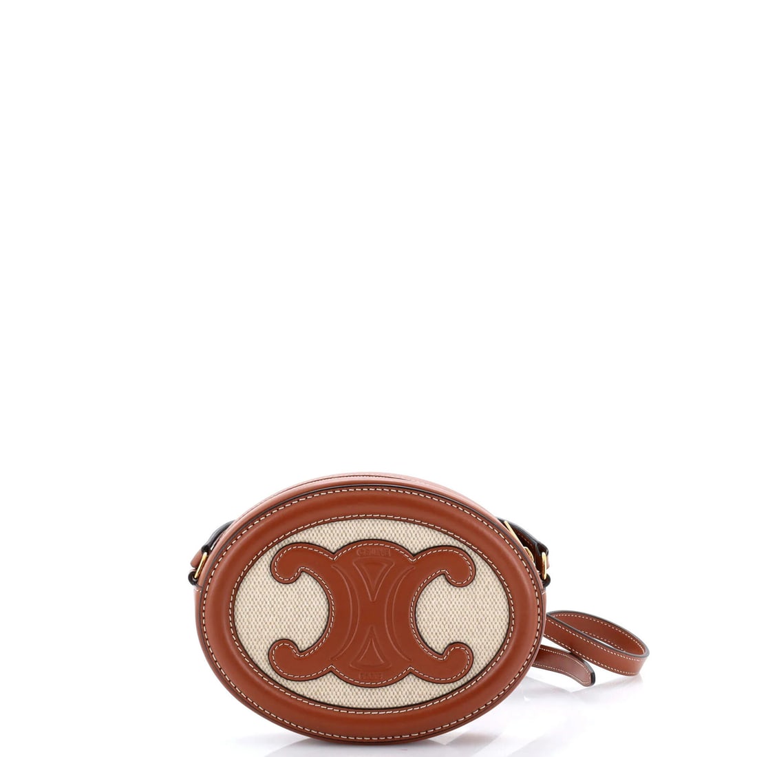 Canvas leather oval crossbody bag triomphe celine: Canvas leather oval crossbody bag triomphe celine Canvas and leather oval crossbody bag with clean lines and classic design, featuring brown canvas exterior and neutral leather interior. Minor scuffs 