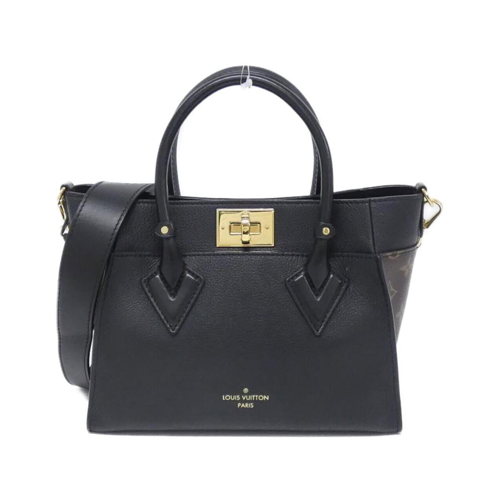Coated Leather Canvas Handbag Louis: Coated Leather Canvas Handbag Louis Black Coated Leather Canvas Handbag from Louis Vuitton features calf leather and coated canvas materials, with a size of 20cm x 27cm x 12cm. The bag includes a dust