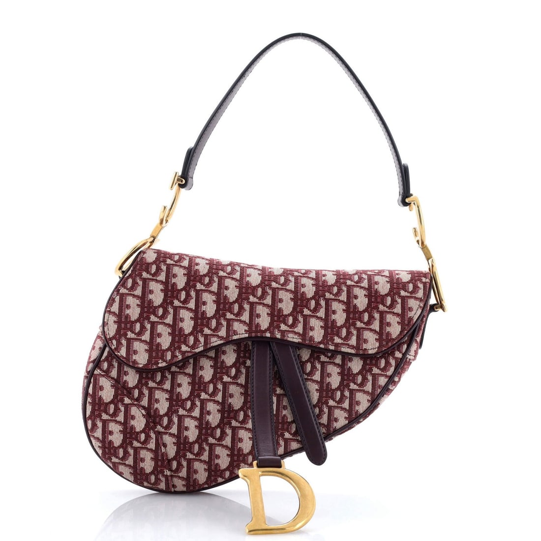 Canvas handbag saddle oblique medium Christian Dior: Canvas handbag saddle oblique medium Christian Dior Canvas handbag saddle oblique medium Christian Dior, featuring a striking red canvas exterior with subtle creases and minor scuffs. The aged gold ha