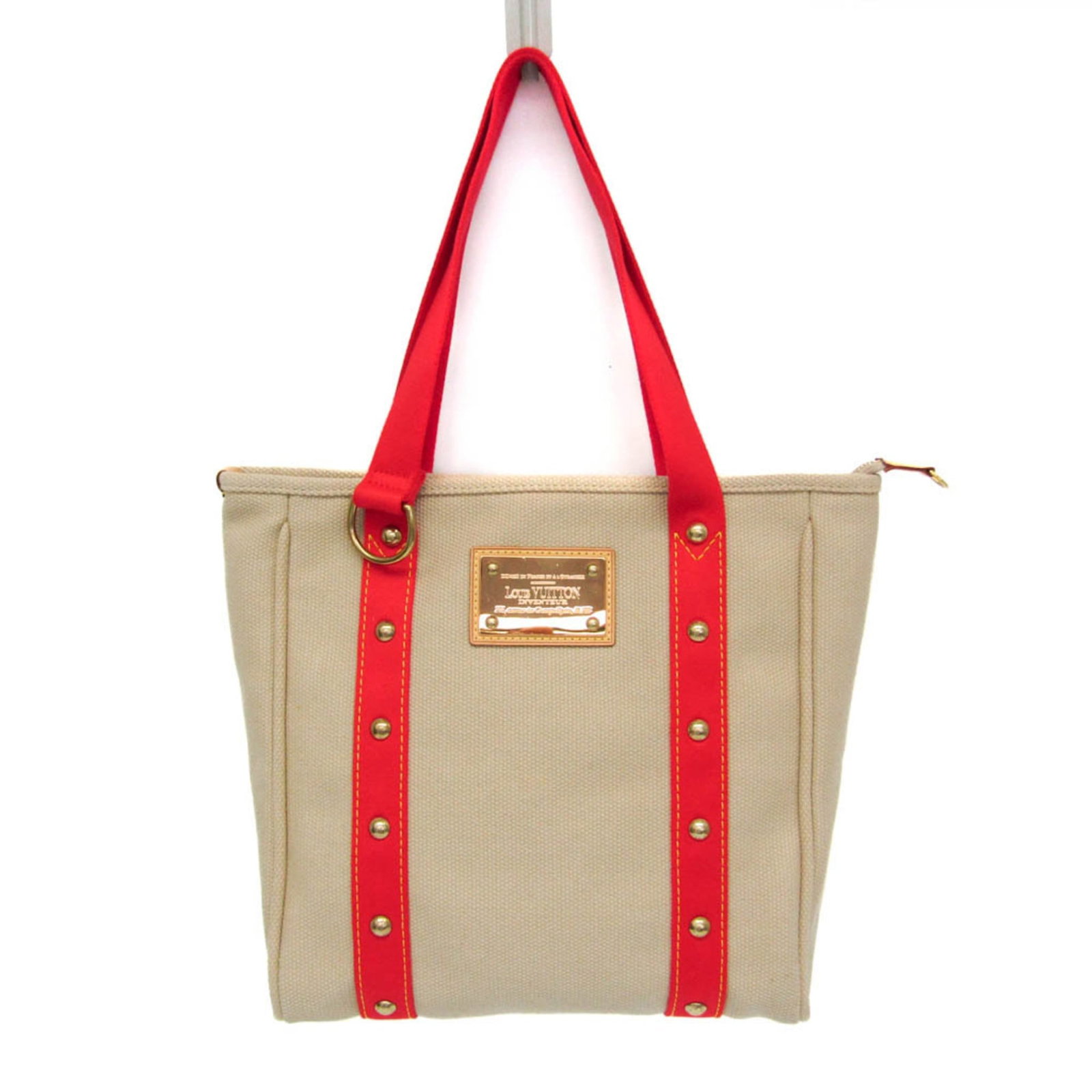 Canvas bag from Louis Vuitton: Canvas bag from Louis Vuitton Canvas bag from Louis Vuitton, featuring a classic Cabas design with a timeless beige and red color combination. This stylish tote boasts gold hardware and a spacious ope