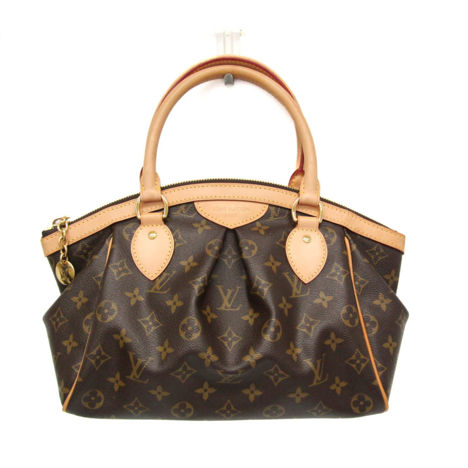 Vuitton Handbag Monogram Louis: Vuitton Handbag Monogram Louis The Vuitton Handbag Monogram Louis boasts its iconic monogram pattern in rich brown, adding a touch of timeless elegance to any outfit. With an open pocket and spacious 