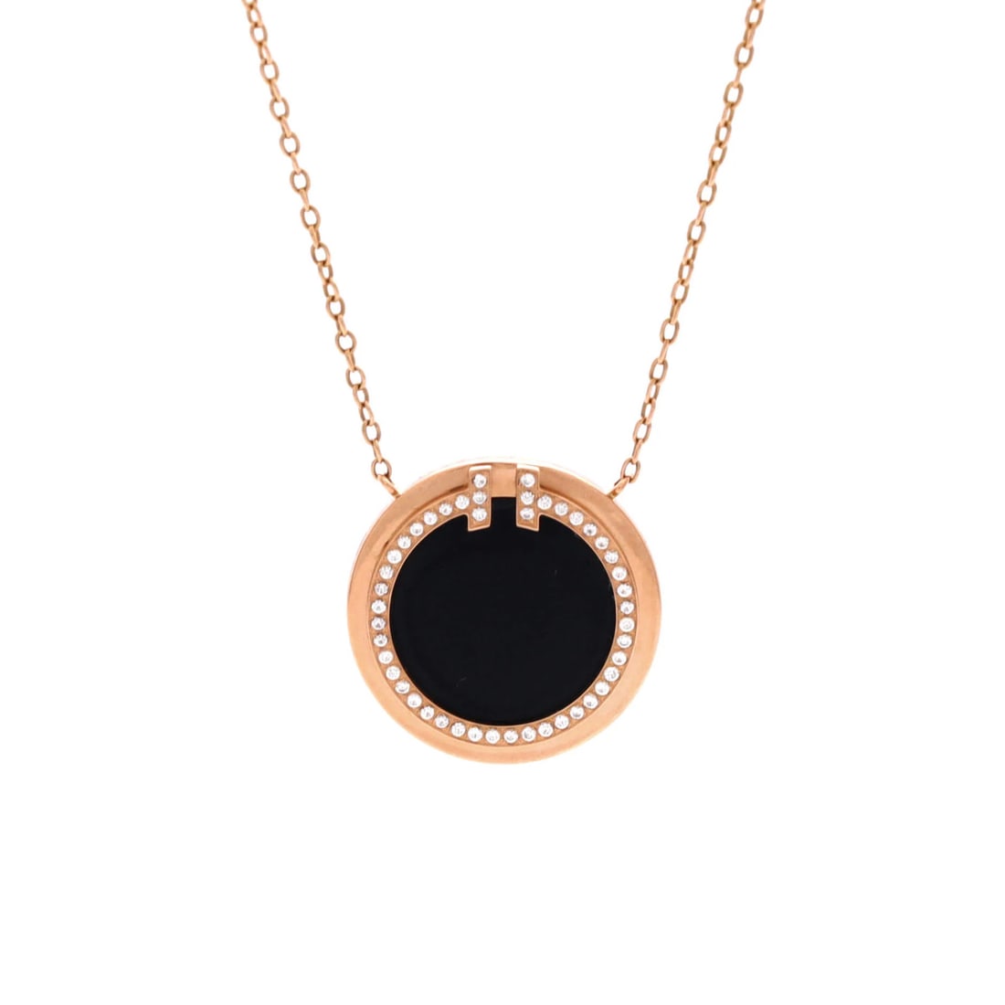 Tiffany & Co. T Circle Pendant Necklace 18K Rose Gold with Onyx and Diamonds: Tiffany & Co. T Circle Pendant Necklace 18K Rose Gold with Onyx and Diamonds Tiffany & Co.'s T Circle Pendant Necklace showcases elegant 18K rose gold craftsmanship. The striking design features onyx 