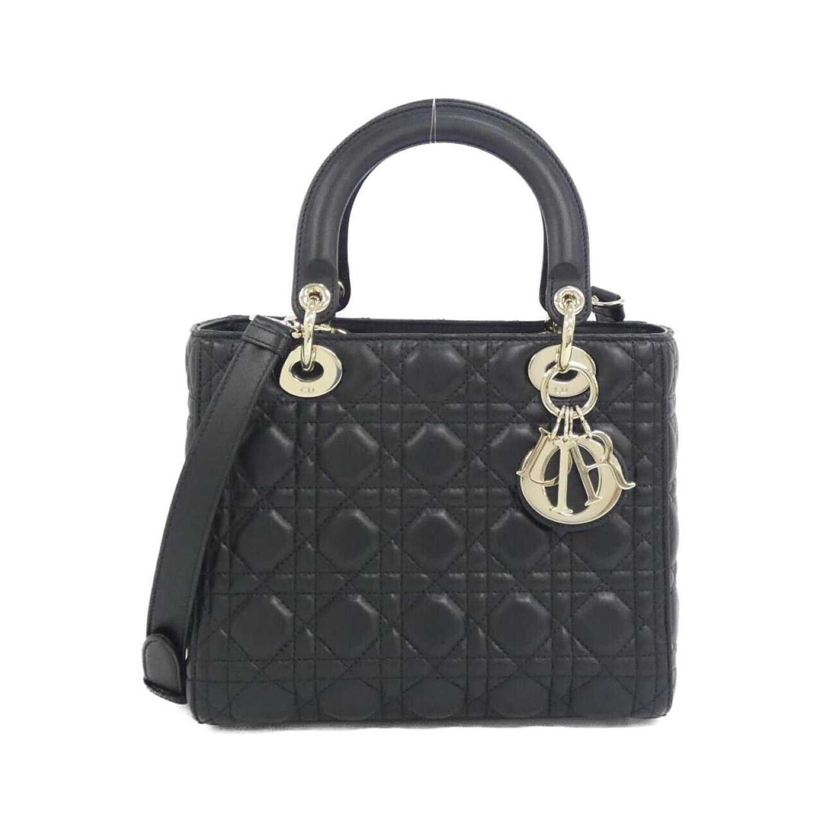 Handbag Christian Dior Leather: Handbag Christian Dior Leather Christian Dior Leather Handbag. Made from high-quality leather, this black handbag features a classic design with clean lines and a timeless look. With its compact size 