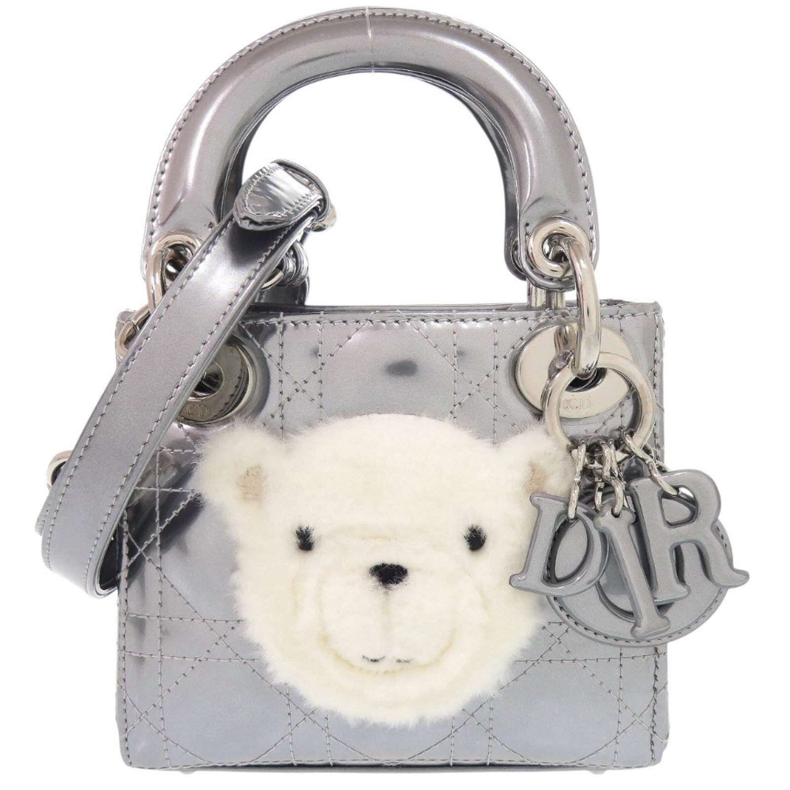 Dior Christian Handbag Patent Leather Fur: Dior Christian Handbag Patent Leather Fur Patent leather and fur come together in this striking Dior Christian handbag, crafted with attention to detail. The silver color adds a touch of sophisticatio