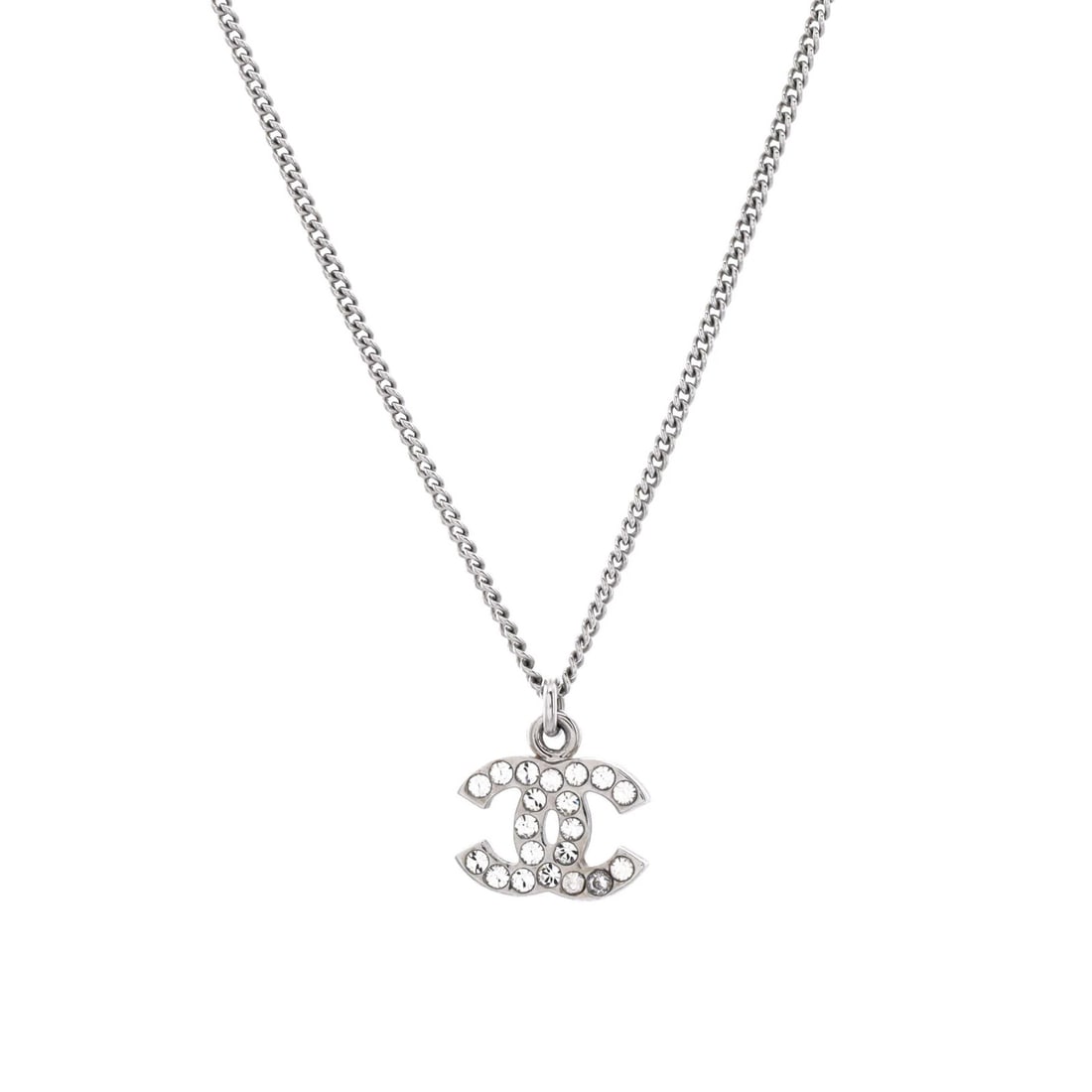 Chanel CC Crystal Logo Necklace Metal: Chanel CC Crystal Logo Necklace Metal Silver Chanel CC Crystal Logo Necklace Metal, measuring 17" in height and 11" in width, features an exterior color of silver and a metal material. The necklace bo