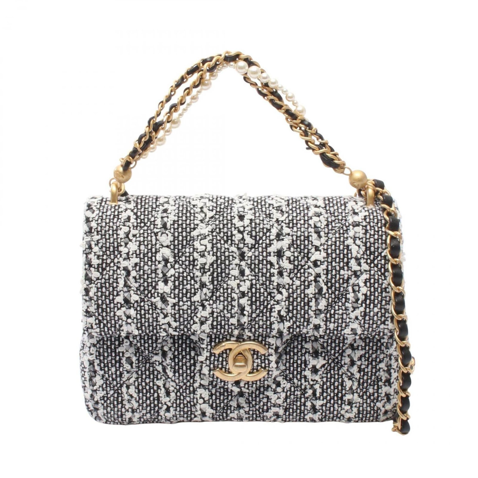 Handbag Leather Fabric Shoulder Bag by Chanel: Handbag Leather Fabric Shoulder Bag by Chanel Black and White Chanel Handbag Leather Fabric Shoulder Bag. Made from fabric and leather, this shoulder bag features gold hardware in black and white. Dim