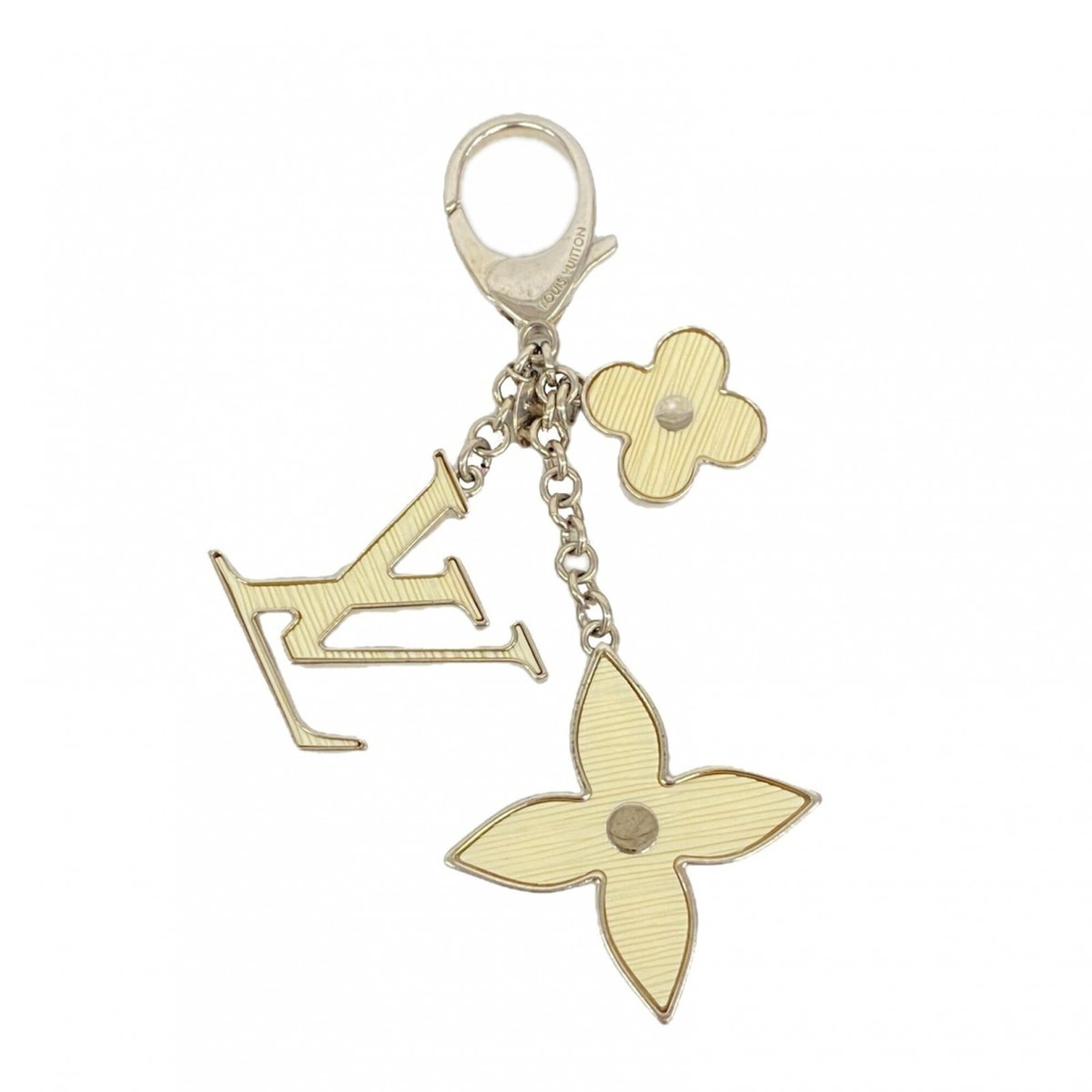 Keyring by Louis Vuitton: Keyring by Louis Vuitton Keyring by Louis Vuitton bears the signature of the iconic brand, adding a touch of elegance to any keychain. Made from high-quality materials, its sleek design and classic