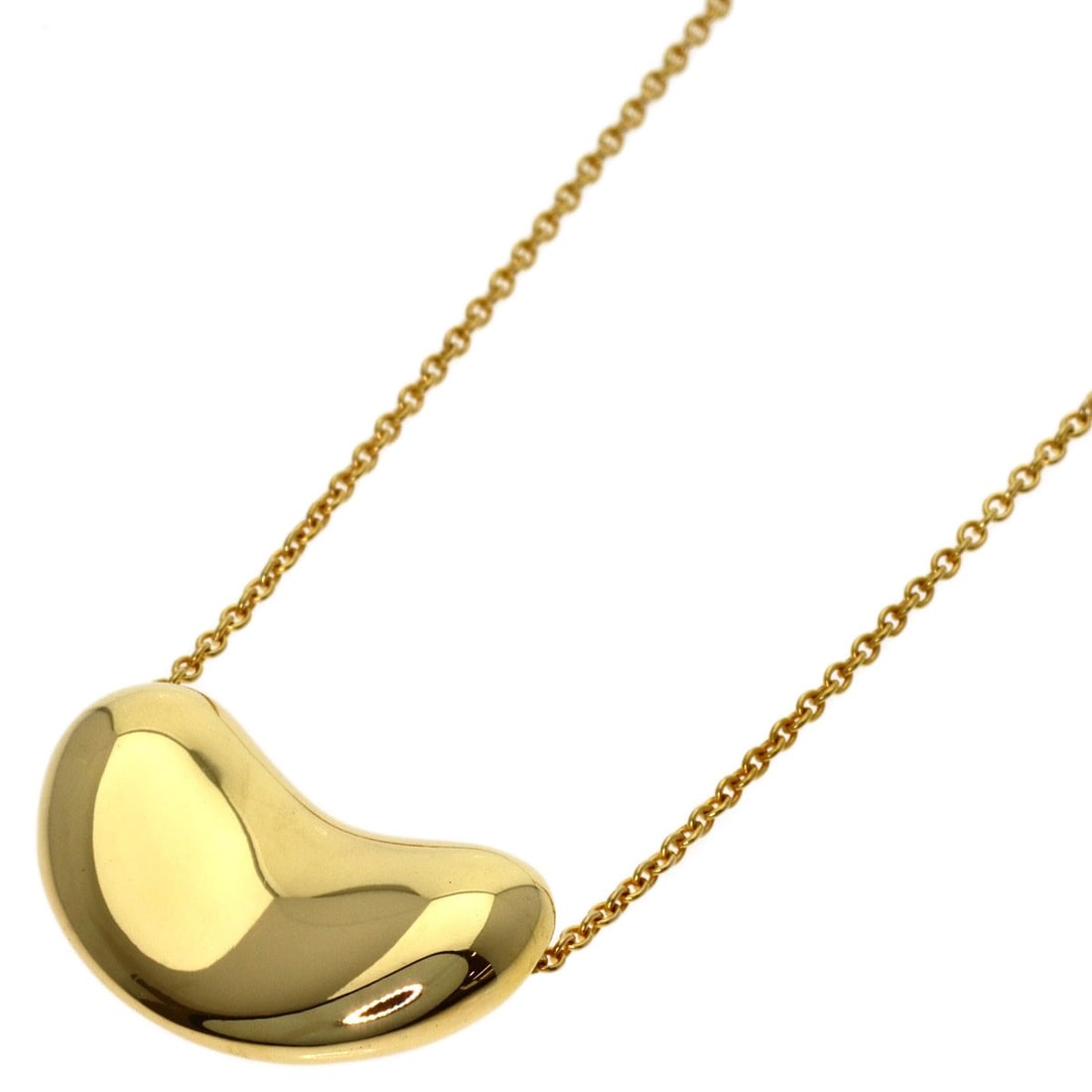 K18 Gold Tiffany Co. Bean Necklace: K18 Gold Tiffany Co. Bean Necklace K18 Gold Tiffany Co. Bean Necklace boasts a sleek, 16.5-inch length crafted from K18 yellow gold, a rare and luxurious metal alloy. This statement necklace features 
