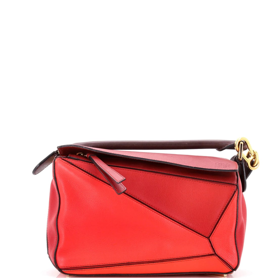 Small Leather Puzzle Bag Loewe: Small Leather Puzzle Bag Loewe Small Leather Puzzle Bag Loewe in Red. This small leather satchel features a classic design with a red exterior and gold hardware, measuring 6" tall and 10" wide. The