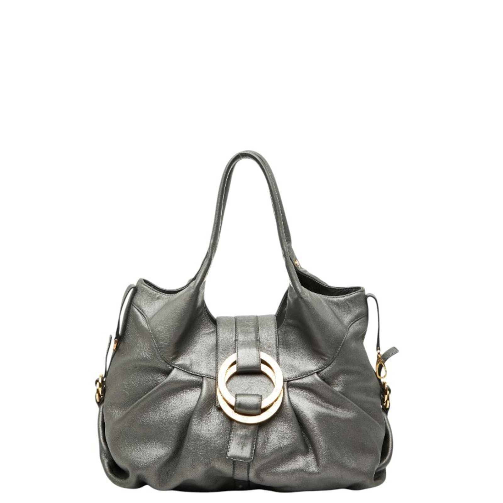 Handbag Leather Bvlgari: Handbag Leather Bvlgari Gray Bvlgari Chandra handbag made from high-quality leather, measuring 26cm x 40cm. This stylish bag features a distinctive design and signature, adding to its unique character