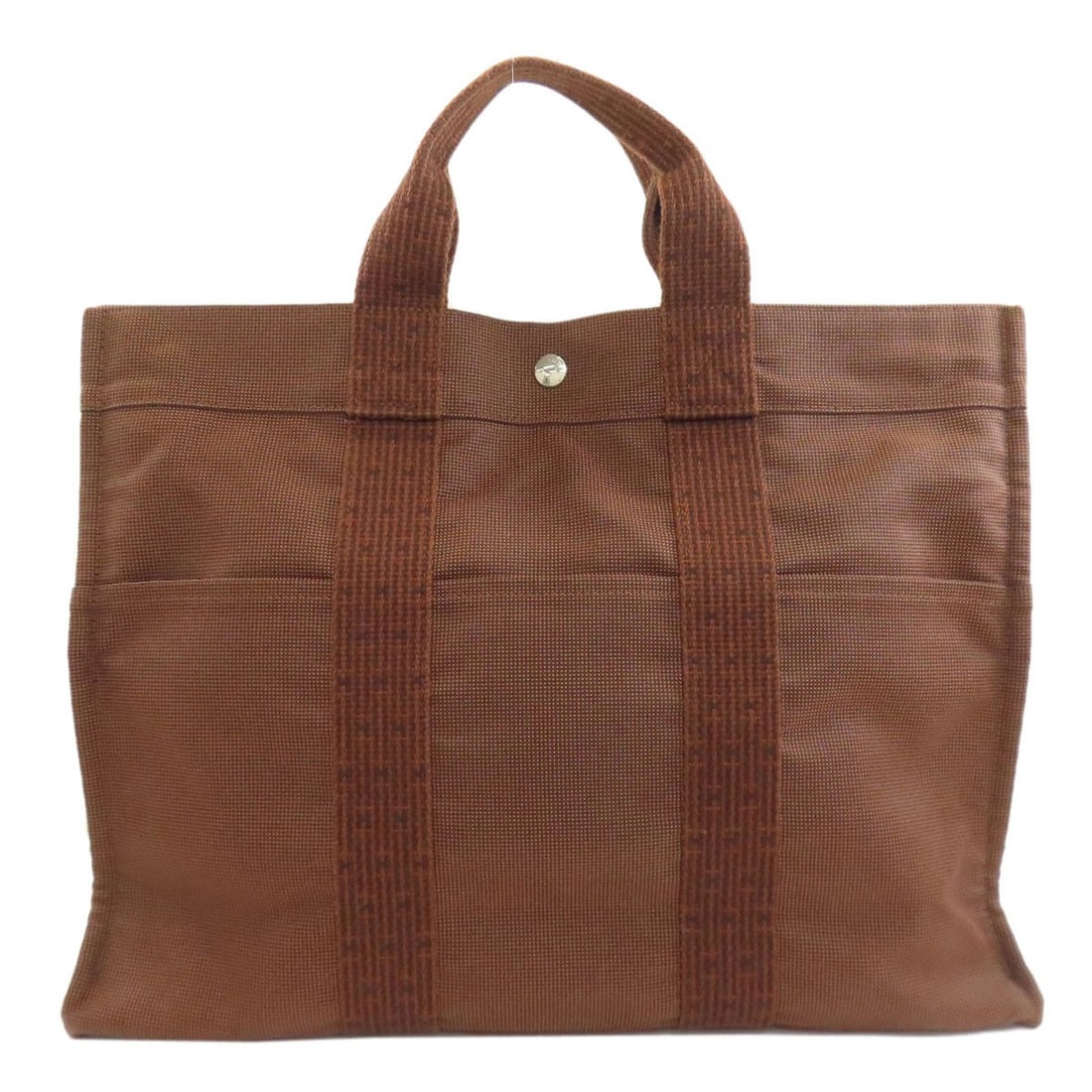 Hermes Her Linemm Handbag Canvas: Hermes Her Linemm Handbag Canvas Brown canvas handbag from HERMES, featuring a classic style with a timeless design. The bag's exterior is made of high-quality canvas material, providing a durable and