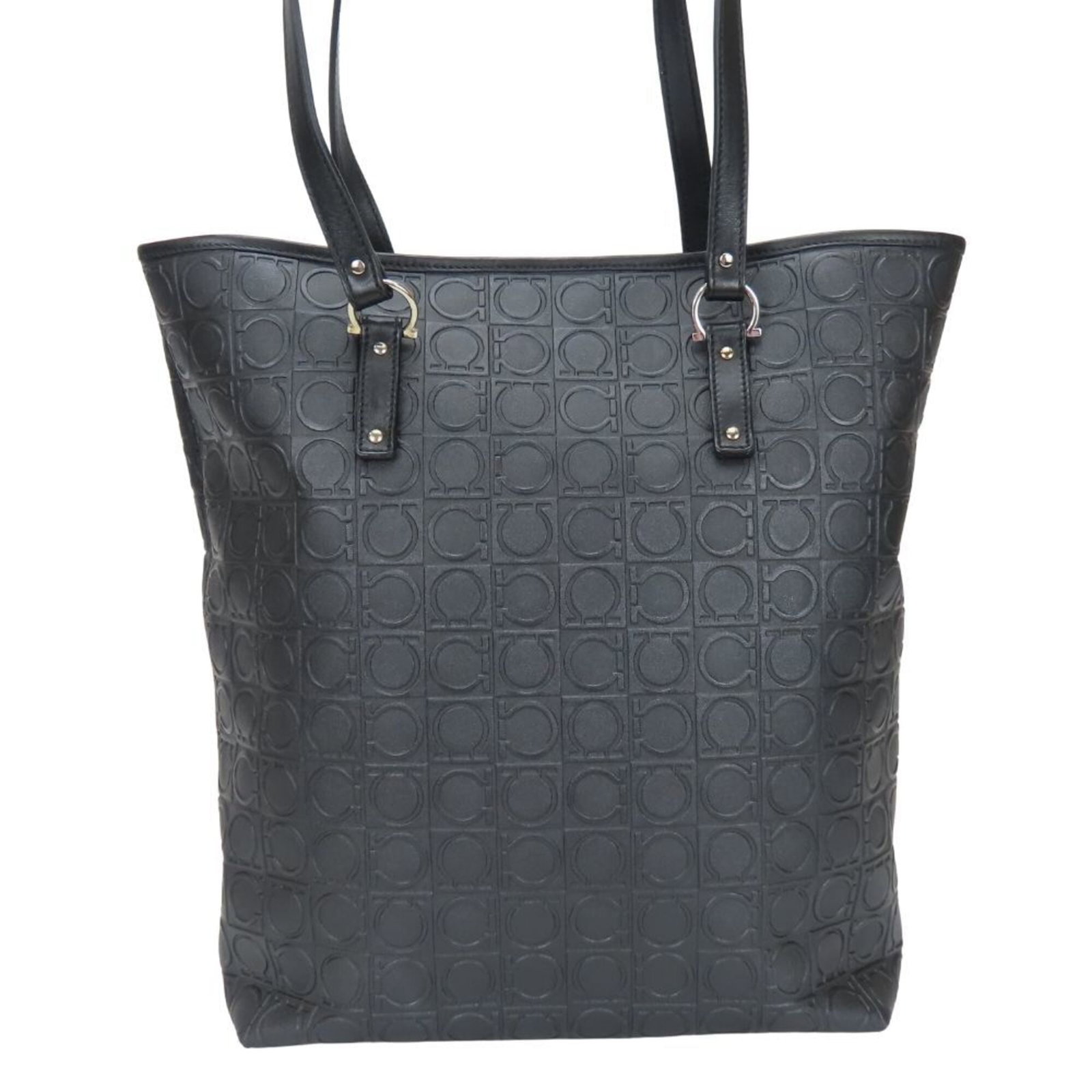 PVC Tote Bag Salvatore Ferragamo: PVC Tote Bag Salvatore Ferragamo Black PVC tote bag featuring the iconic Gancini design from Salvatore Ferragamo. The sleek, modern shape and durable PVC material make it a versatile accessory for