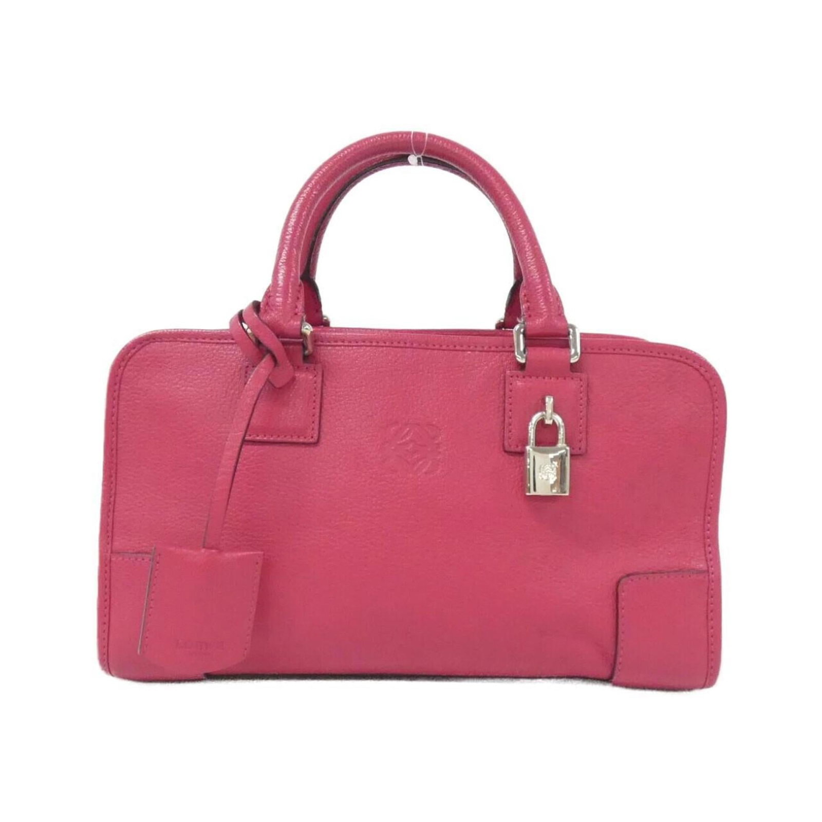 Handbag Leather from Loewe: Handbag Leather from Loewe Loewe's iconic handbag features premium goatskin leather in a stunning pink hue, complemented by silver hardware. The compact design measures 17cm x 29cm x 13cm and comes wi