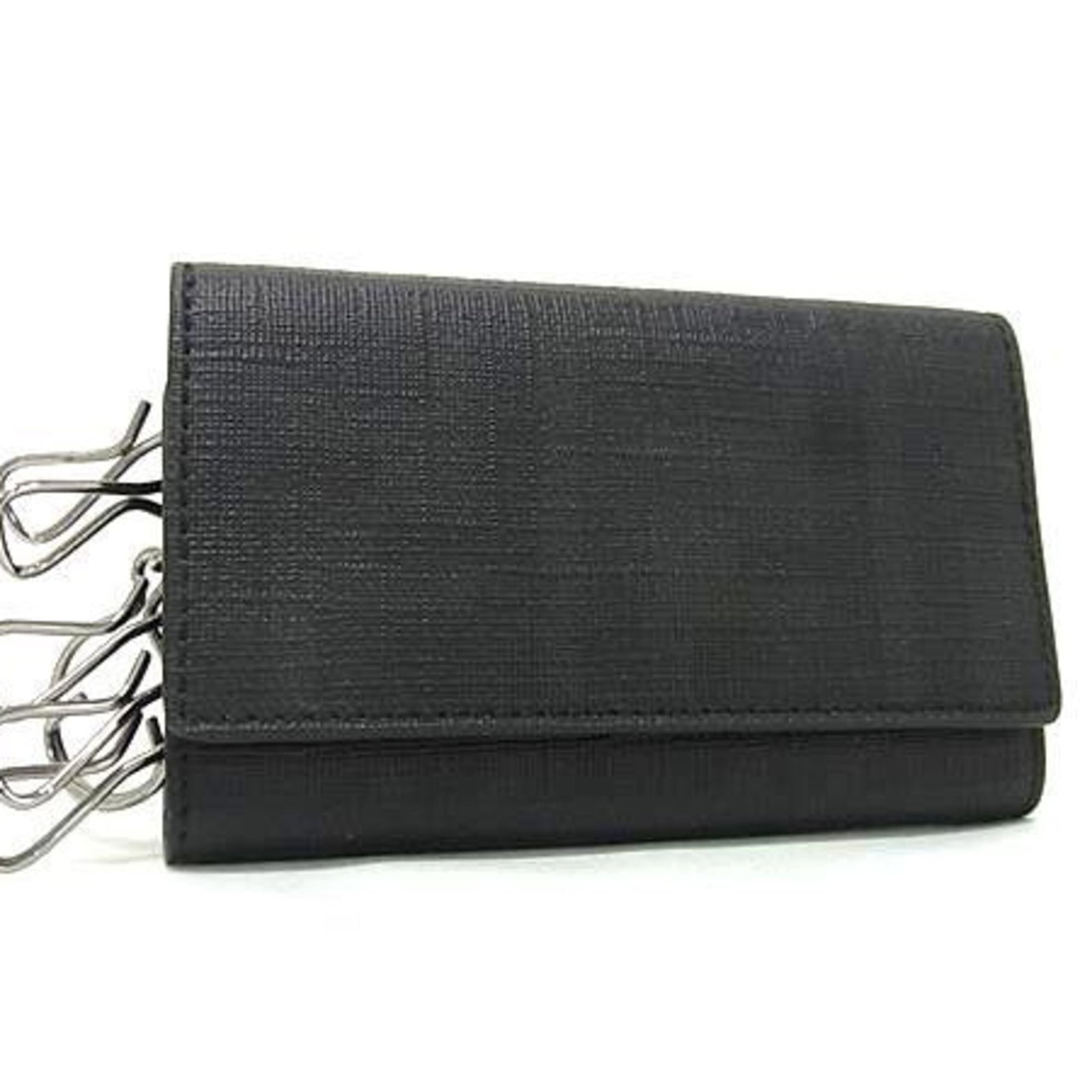PVC Leather Fendi Keycase: PVC Leather Fendi Keycase Fendi's Country of Origin: Italy, the Italian luxury brand is known for its high-quality designs. This PVC Leather Fendi Keycase features a sleek black design with a durable 