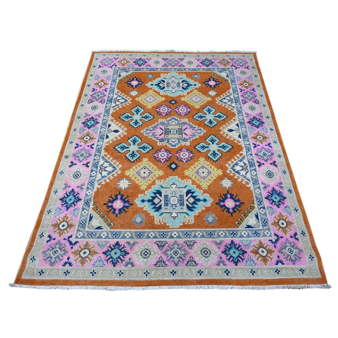 4'9"x6'5" Alloy Orange Pure And Shiny Wool Fusion Kazak Oriental Rug: 4'9"x6'5" Alloy Orange Pure And Shiny Wool Fusion Kazak Oriental Rug The 4'9"x6'5" Alloy Orange Pure And Shiny Wool Fusion Kazak Oriental Rug boasts a vibrant orange field with intricate regional desi