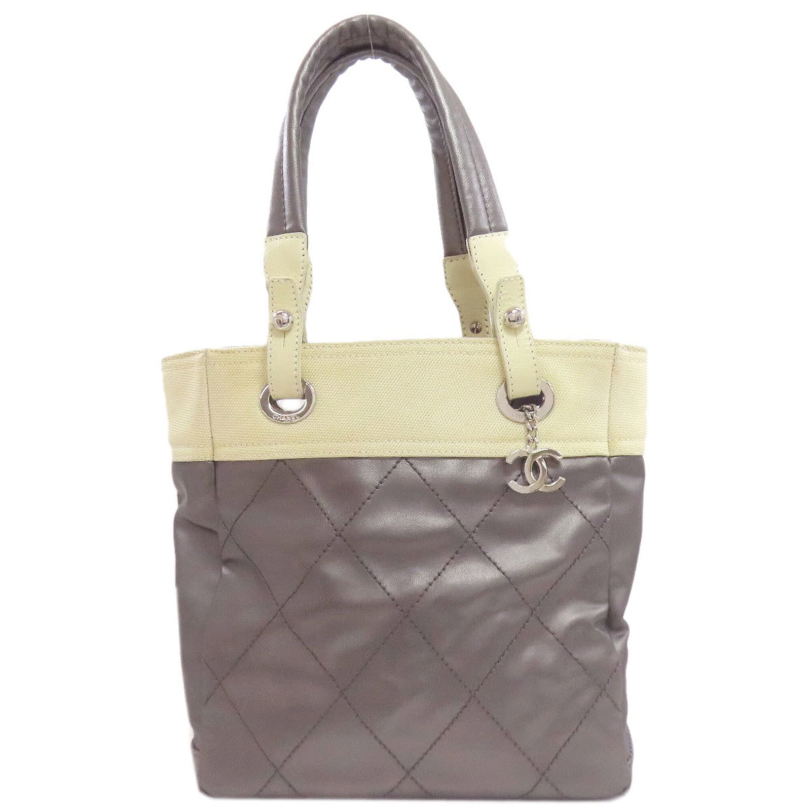Chanel Handbag leather: Chanel Handbag leather Calfskin leather from the iconic Chanel brand, available in silver and white. This handbag measures 27cm x 33cm x 11cm, making it a stylish and compact accessory. The sleek desi