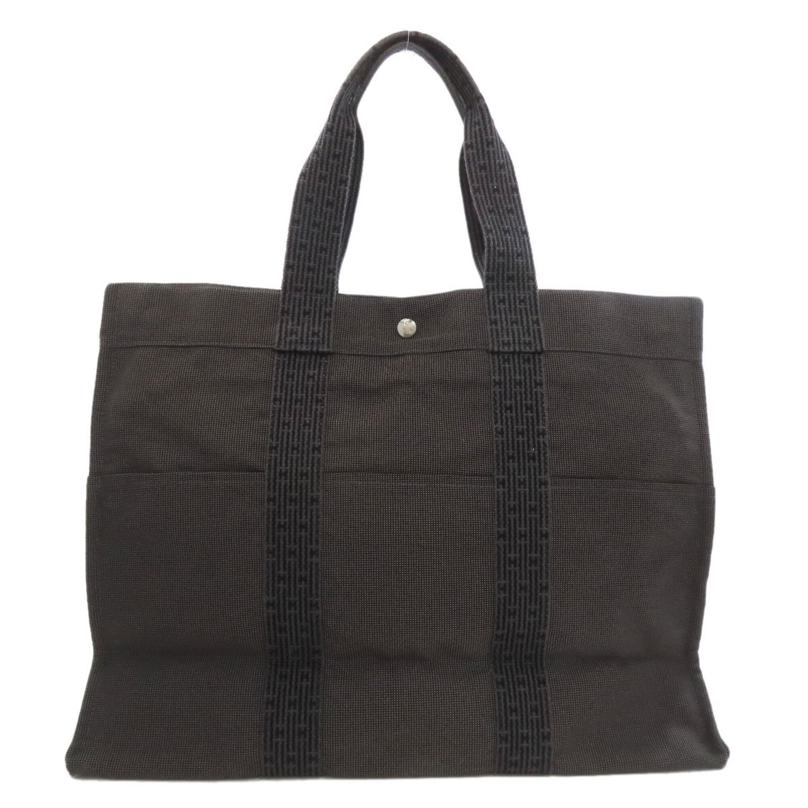 Hermes Tote Bag Canvas: Hermes Tote Bag Canvas Canvas tote bag from Hermes, featuring a timeless gray color and classic design. Measuring 36cm x 47cm x 15cm, it provides ample space for daily essentials. Made from high-quali