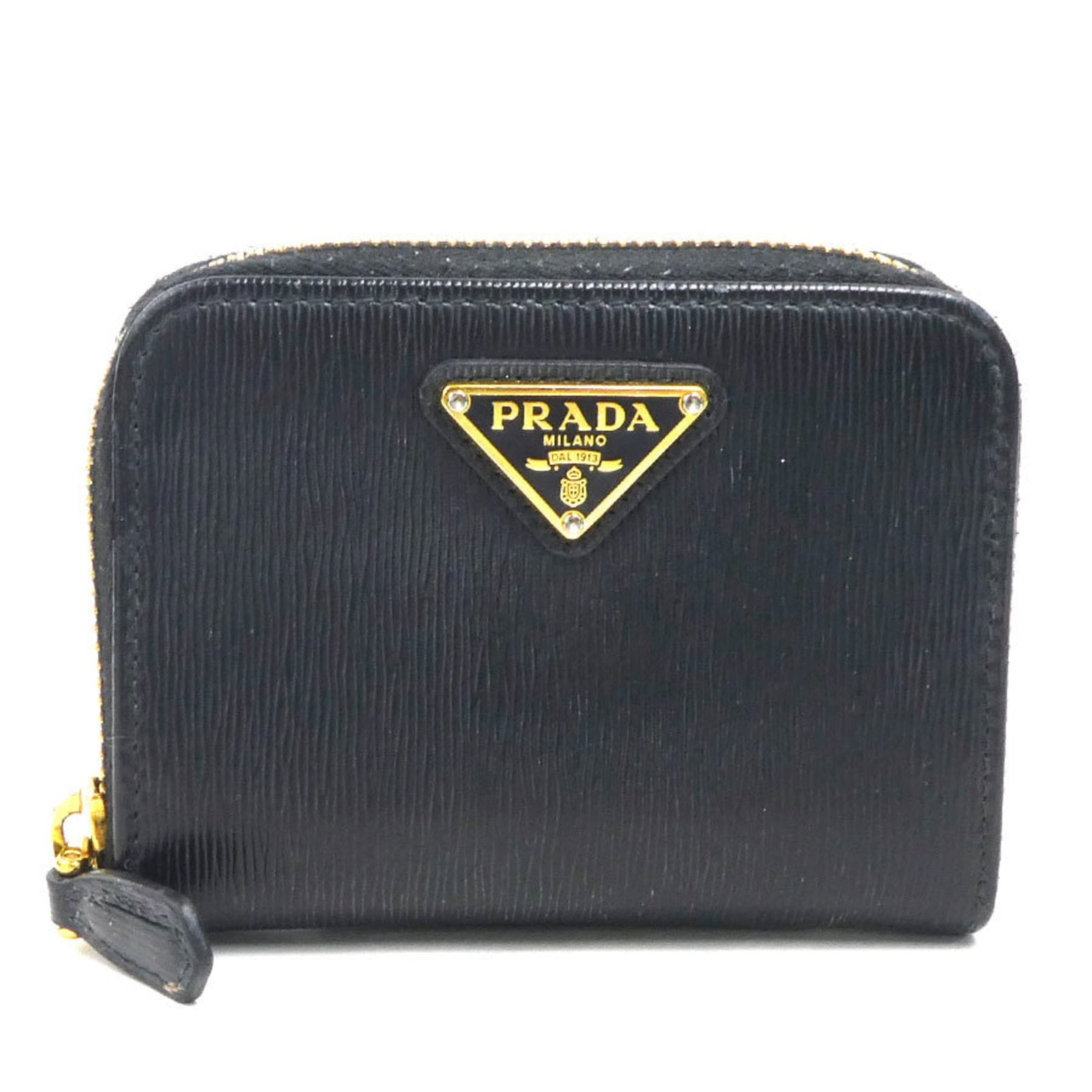 Prada Coin Purse/ Coin Case Leather: Prada Coin Purse/ Coin Case Leather Black Prada leather coin purse/coin case with precise measurements and included box. Made from high-quality leather, this compact accessory features a sleek design 