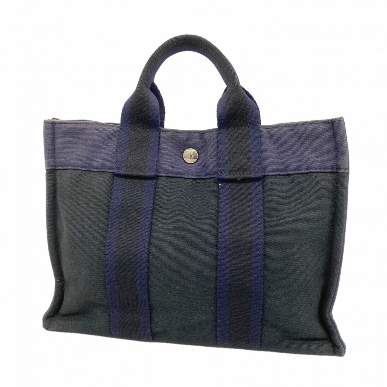 Hermes Tote Bag Canvas: Hermes Tote Bag Canvas Canvas tote bag from Hermes, made with high-quality canvas material and featuring silver hardware. Measuring 22cm x 30cm x 8cm, it has a sleek and classic design that makes it a