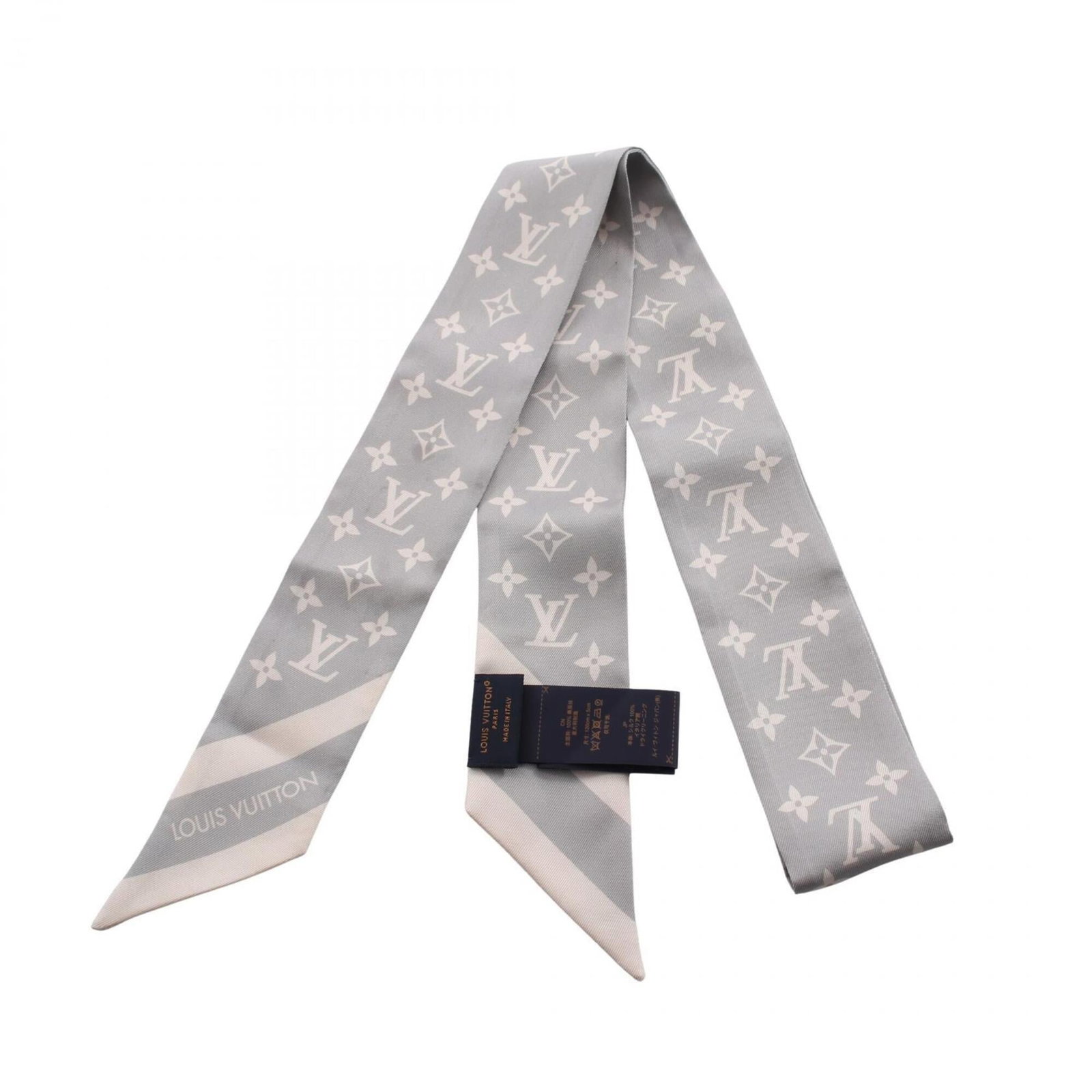 Silk Scarf by Louis Vuitton: Silk Scarf by Louis Vuitton Silk scarf by Louis Vuitton, featuring the iconic Monogram pattern in a versatile gray hue. Made from high-quality silk, this luxurious accessory measures 1.18m x 5cm and a