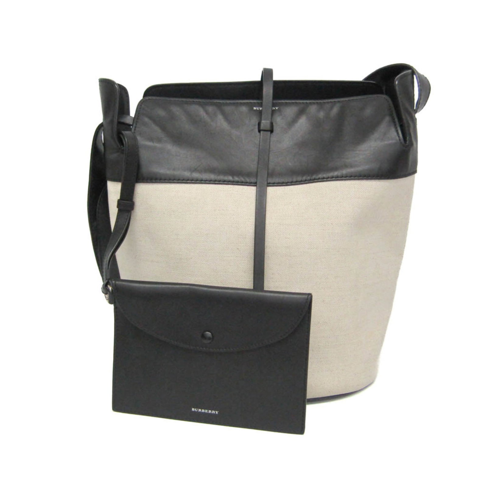 Shoulder Bag Canvas Leather Burberry: Shoulder Bag Canvas Leather Burberry Canvas leather Burberry shoulder bag with a large bucket design, featuring a black and light beige color scheme. The bag has an inner pouch pocket and adjustable s