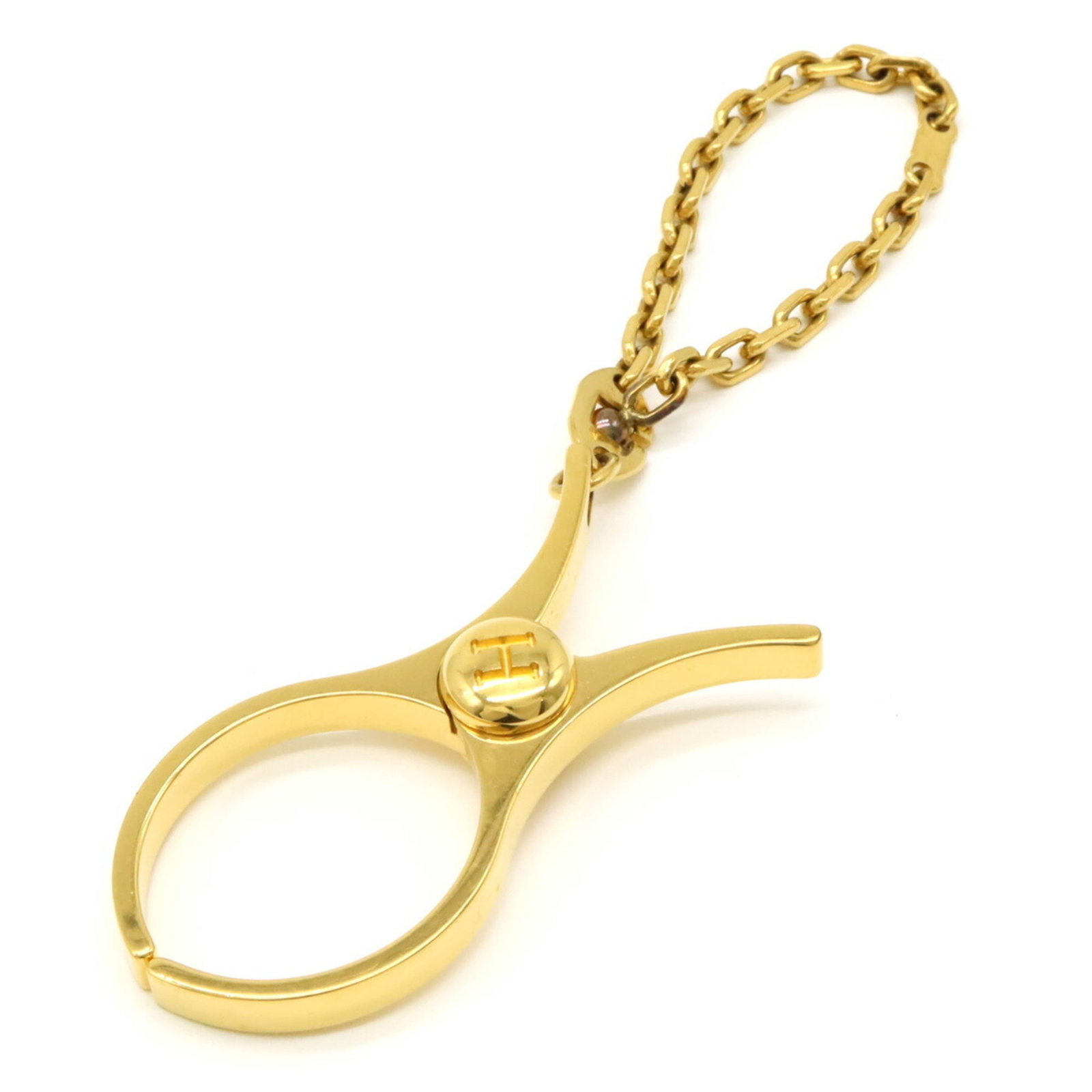 Glove Holder by Hermes: Glove Holder by Hermes Gold plated glove holder by Hermes, measuring 6cm x 2.8cm / 2.36'' x 1.1'', features a sleek and elegant design that complements any accessory collection. This compact holder sh