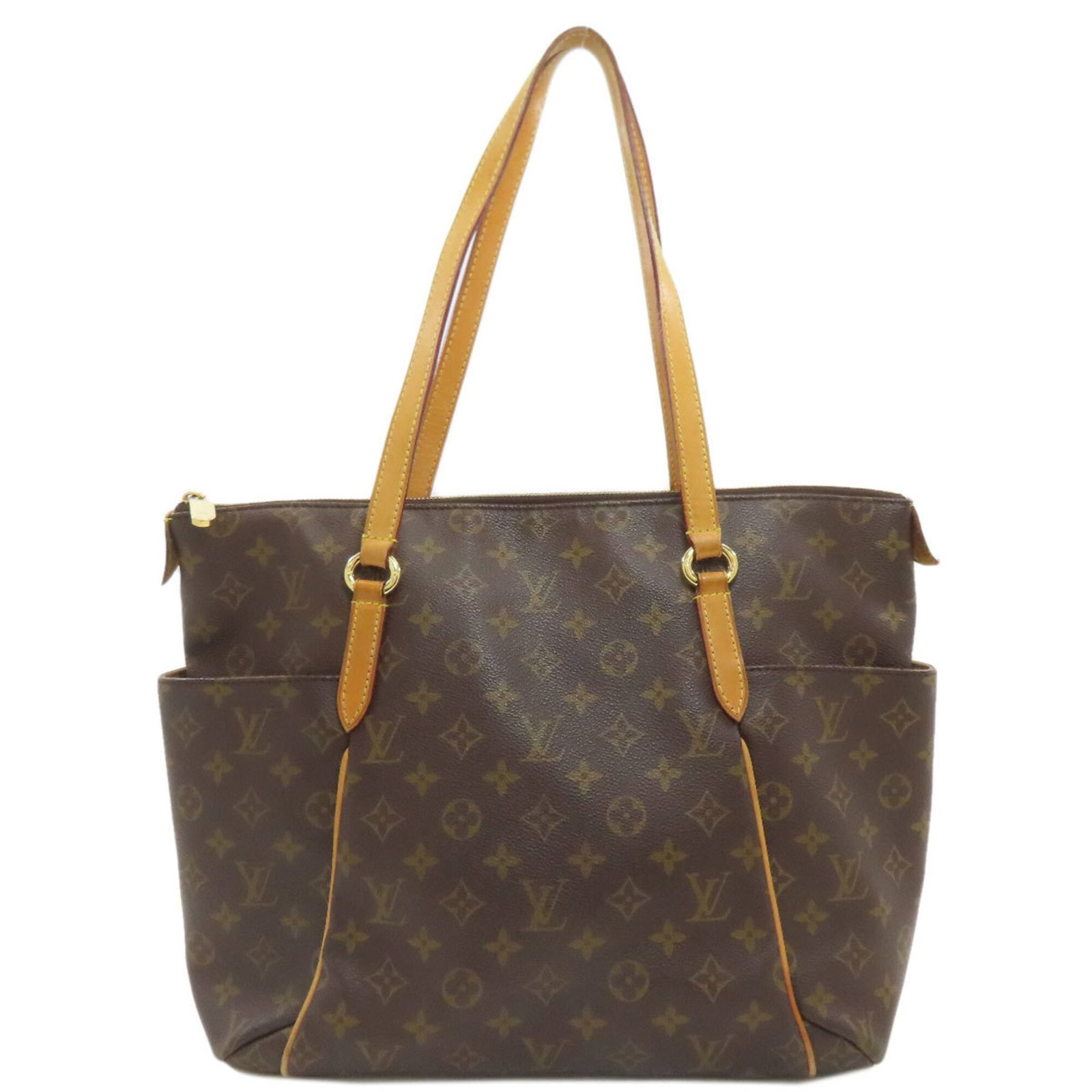 Tote bag monogram Louis Vuitton: Tote bag monogram Louis Vuitton Monogrammed with the iconic Louis Vuitton design, this tote bag boasts a timeless and sophisticated style. Made from high-quality materials, its classic shape and elega