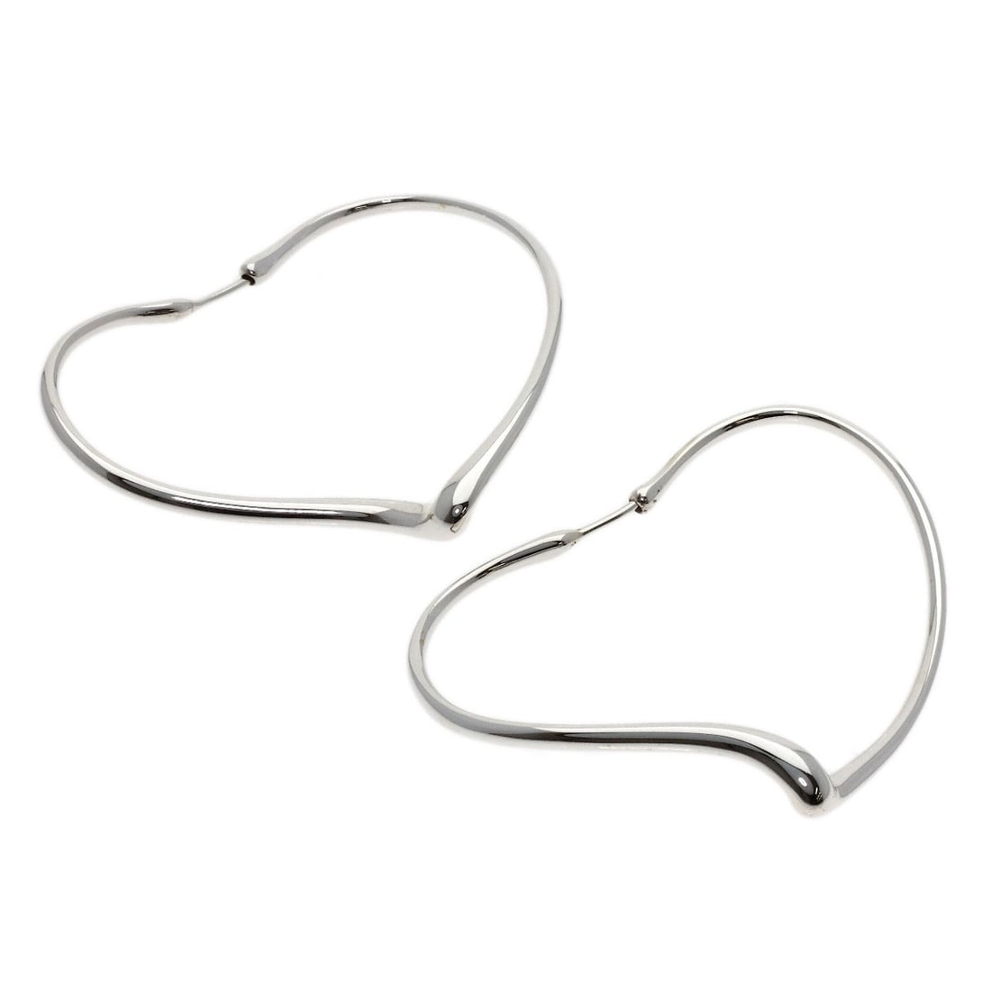 Open Heart Hoop Earring by Tiffany & Co. Silver: Open Heart Hoop Earring by Tiffany & Co. Silver Silver Open Heart Hoop Earring by Tiffany & Co. - A sleek and modern earring featuring an open heart design in sterling silver, showcasing the brand's s