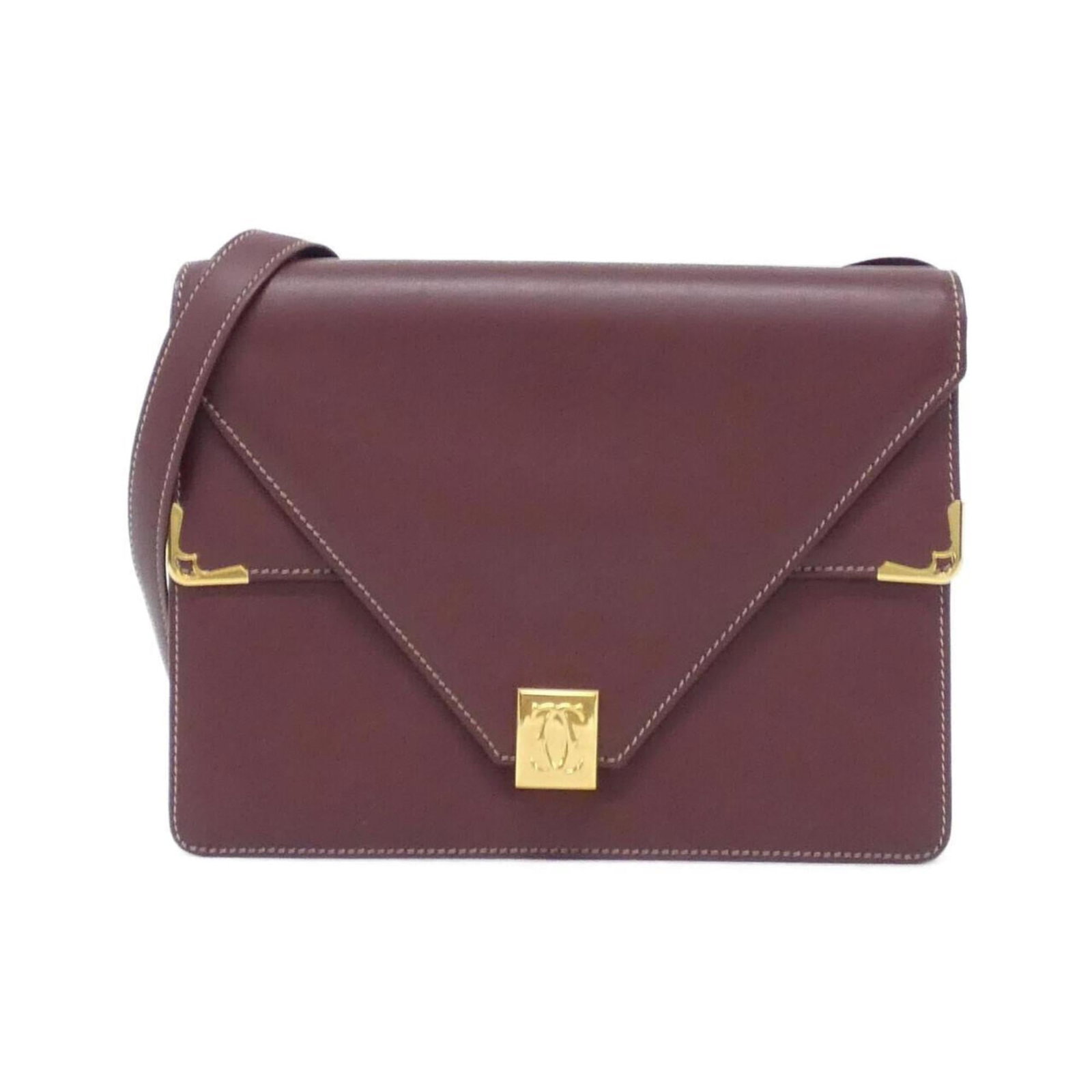 Shoulder Bag Leather by Cartier: Shoulder Bag Leather by Cartier Cartier's Bordeaux leather shoulder bag boasts elegant gold hardware, adding a touch of sophistication to its classic design. With its compact size and sturdy