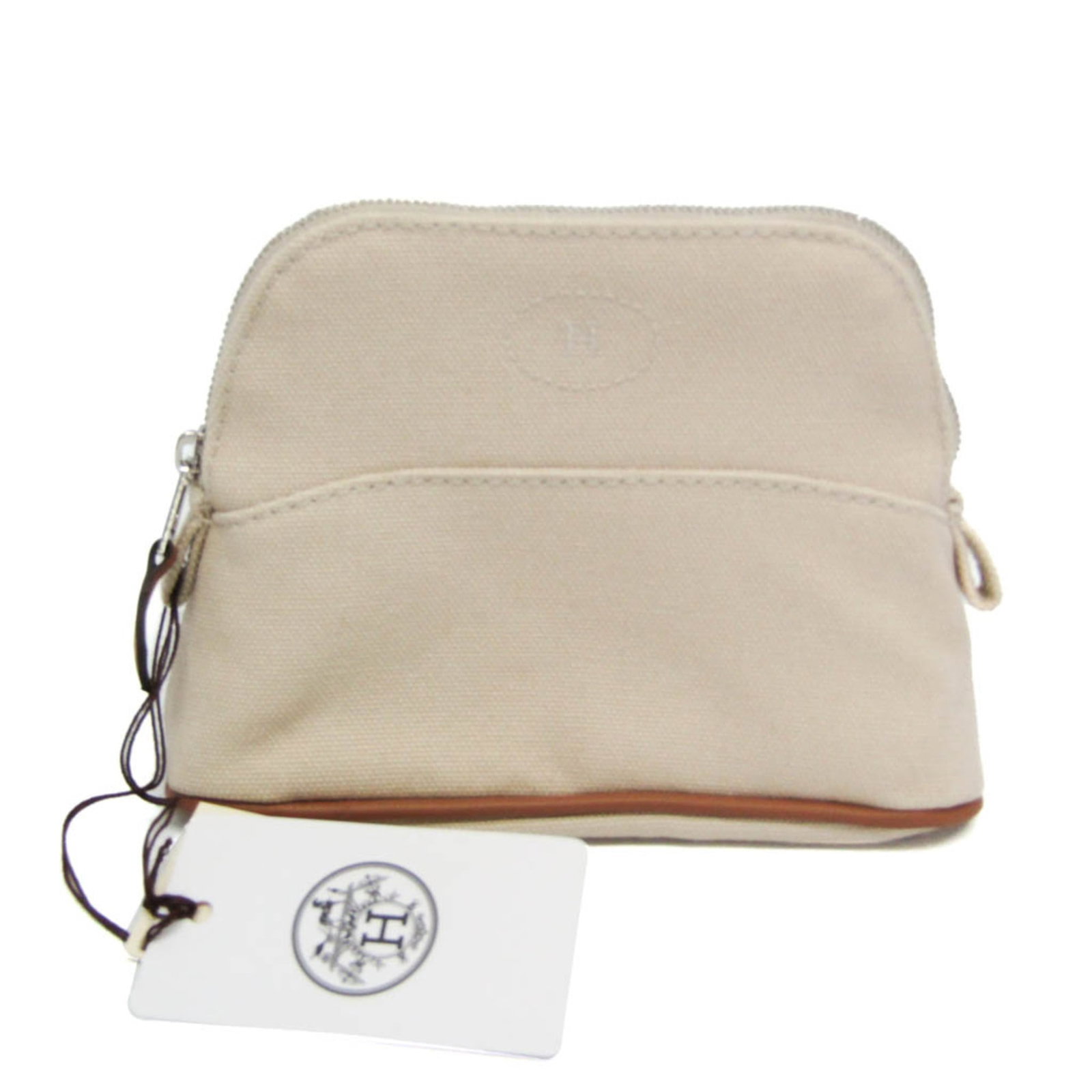 Cotton pouch by Hermes: Cotton pouch by Hermes Cotton pouch by Hermes, featuring a light beige color and a zipper closure. Made from cotton with a polyester lining, this small country-style pouch measures 11cm x 15cm x 5.5cm