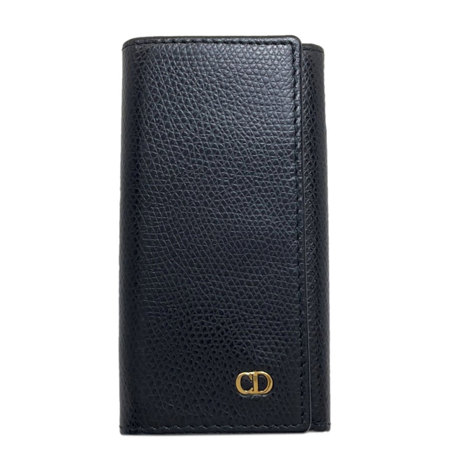 Christian Dior Keycase Leather: Christian Dior Keycase Leather Christian Dior Keycase Leather, a sleek and sophisticated accessory, boasts its classic design in black leather. Measuring just 6cm x 11cm x 1.5cm, it's the perfect size