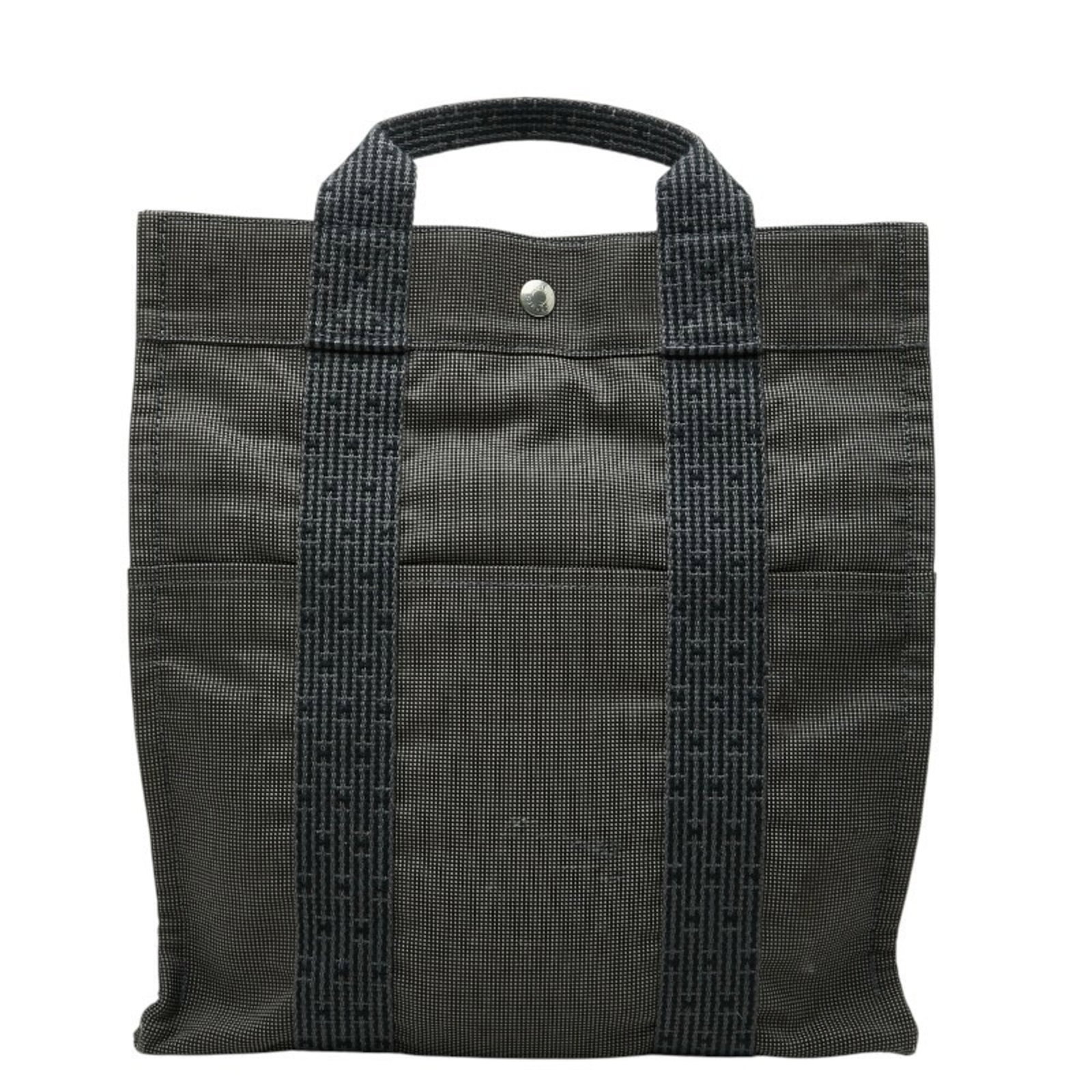 Canvas handbag backpack by Hermes: Canvas handbag backpack by Hermes Canvas handbag backpack by Hermes, featuring a timeless gray color and classic design. Made from high-quality canvas material, this stylish backpack measures 34cm x 3