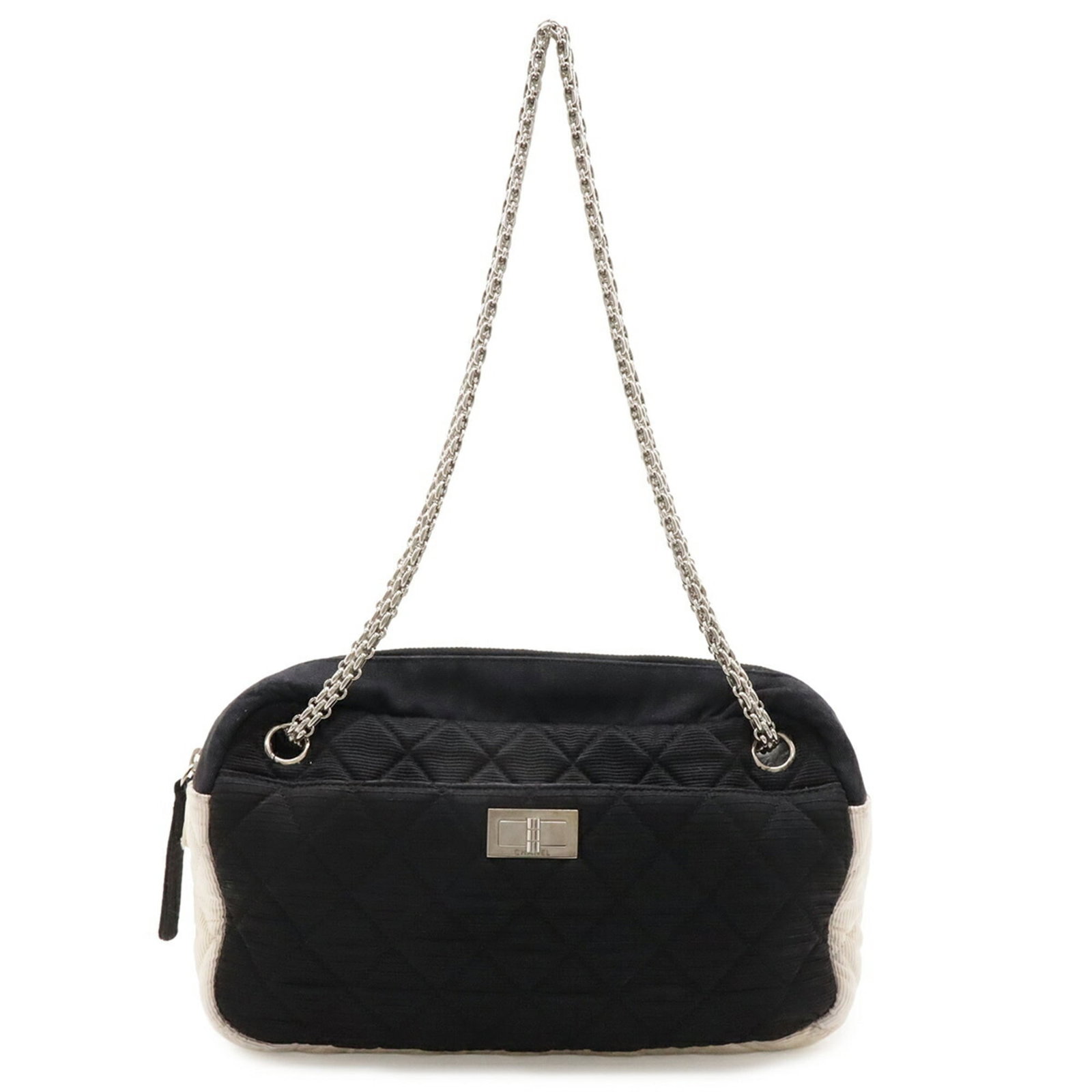 Satin canvas bag by Chanel: Satin canvas bag by Chanel Satin canvas bag by Chanel boasts sleek, sophisticated design with satin and canvas materials in black and ivory hues. The silver hardware adds a touch of elegance to this t