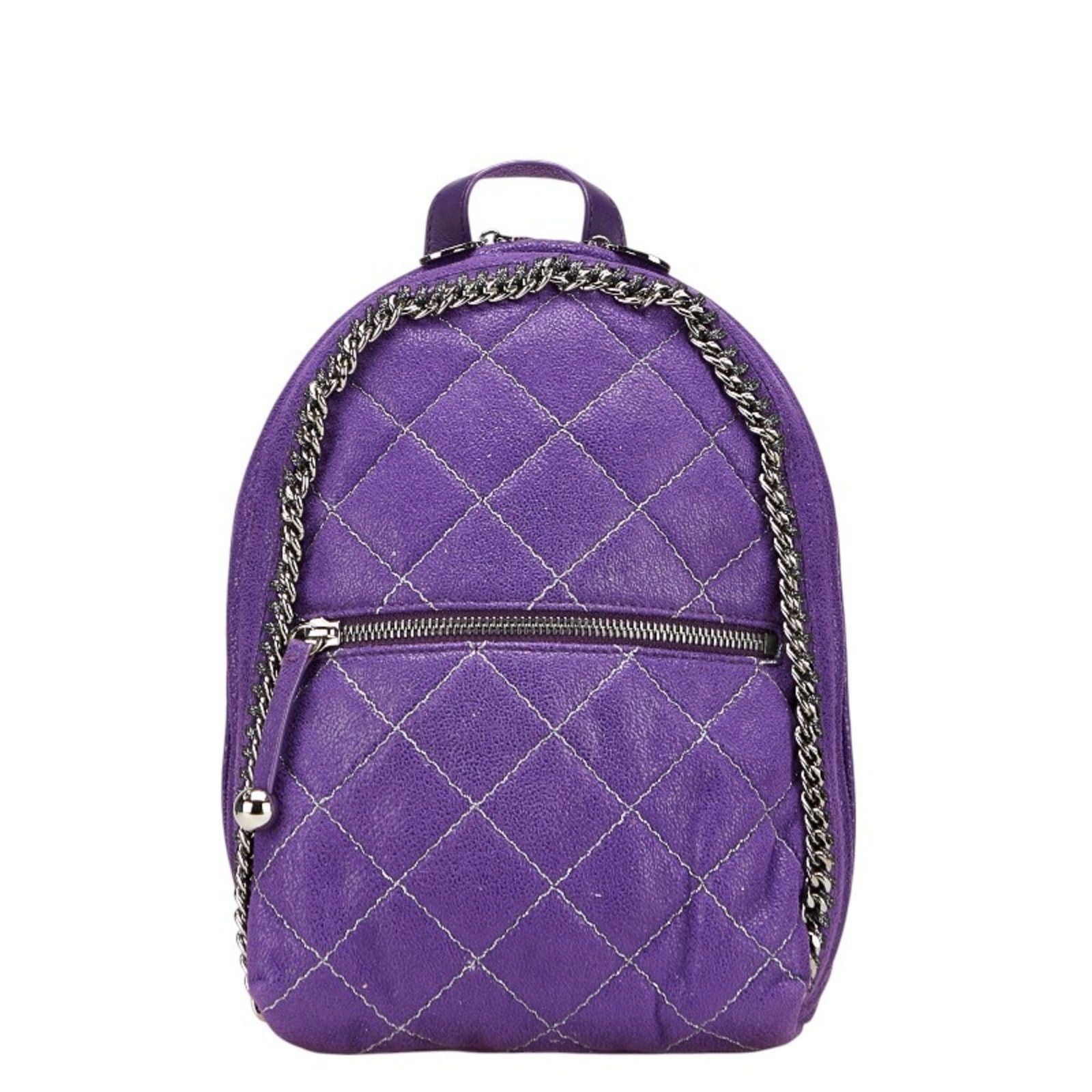 Stella McCartney Leather Polyester Backpack: Stella McCartney Leather Polyester Backpack Purple leather and polyester backpack with a zipper closure, measuring 23cm x 17cm x 8cm. Comes with a dust bag for added protection, featuring a signature 
