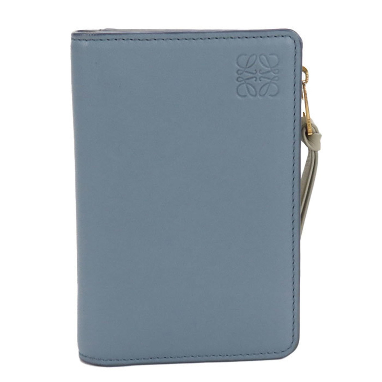 Loewe Wallet (Bi-Fold) Leather: Loewe Wallet (Bi-Fold) Leather Calfskin leather construction provides durability and style to this bi-fold wallet from Loewe, Spain. The blue color adds a touch of elegance to its compact design, meas