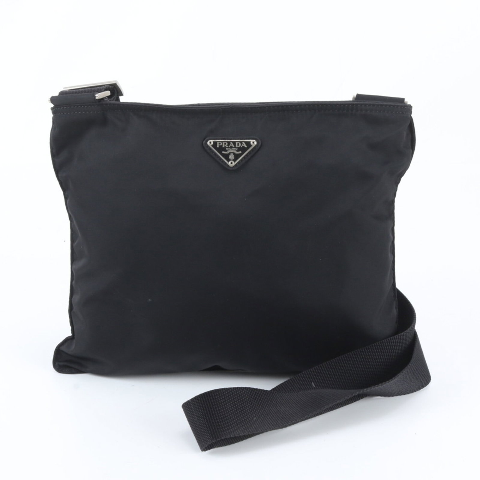 Nylon leather shoulder bag by Prada: Nylon leather shoulder bag by Prada Prada's nylon leather shoulder bag boasts a sleek black design, combining durable nylon with premium leather accents. Measuring 24cm x 32cm x 2cm, this stylish acce