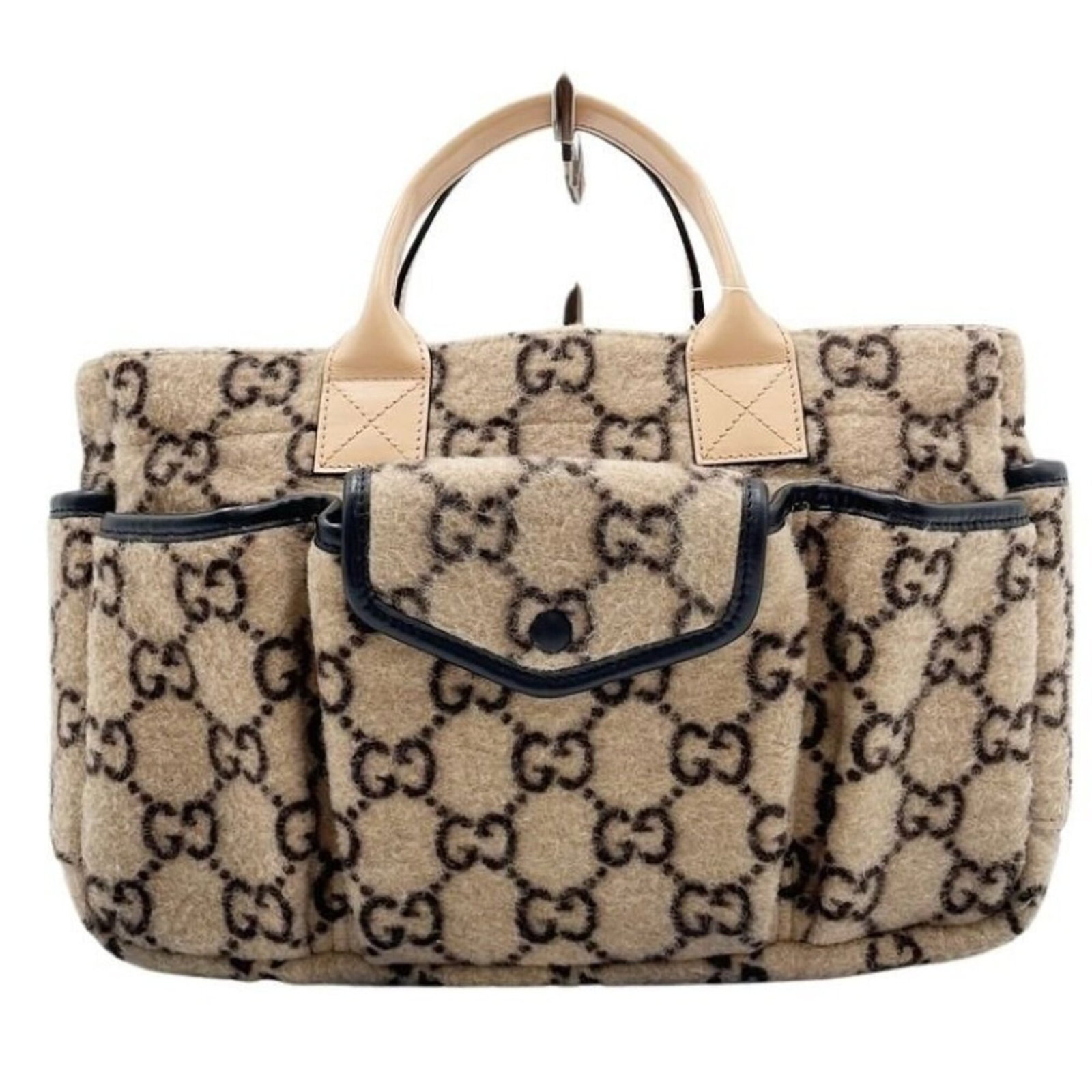 Wool leather handbag Gucci: Wool leather handbag Gucci Wool and leather blend in this unique Gucci handbag, featuring a natural beige color. Made from high-quality materials, its compact size makes it perfect for everyday