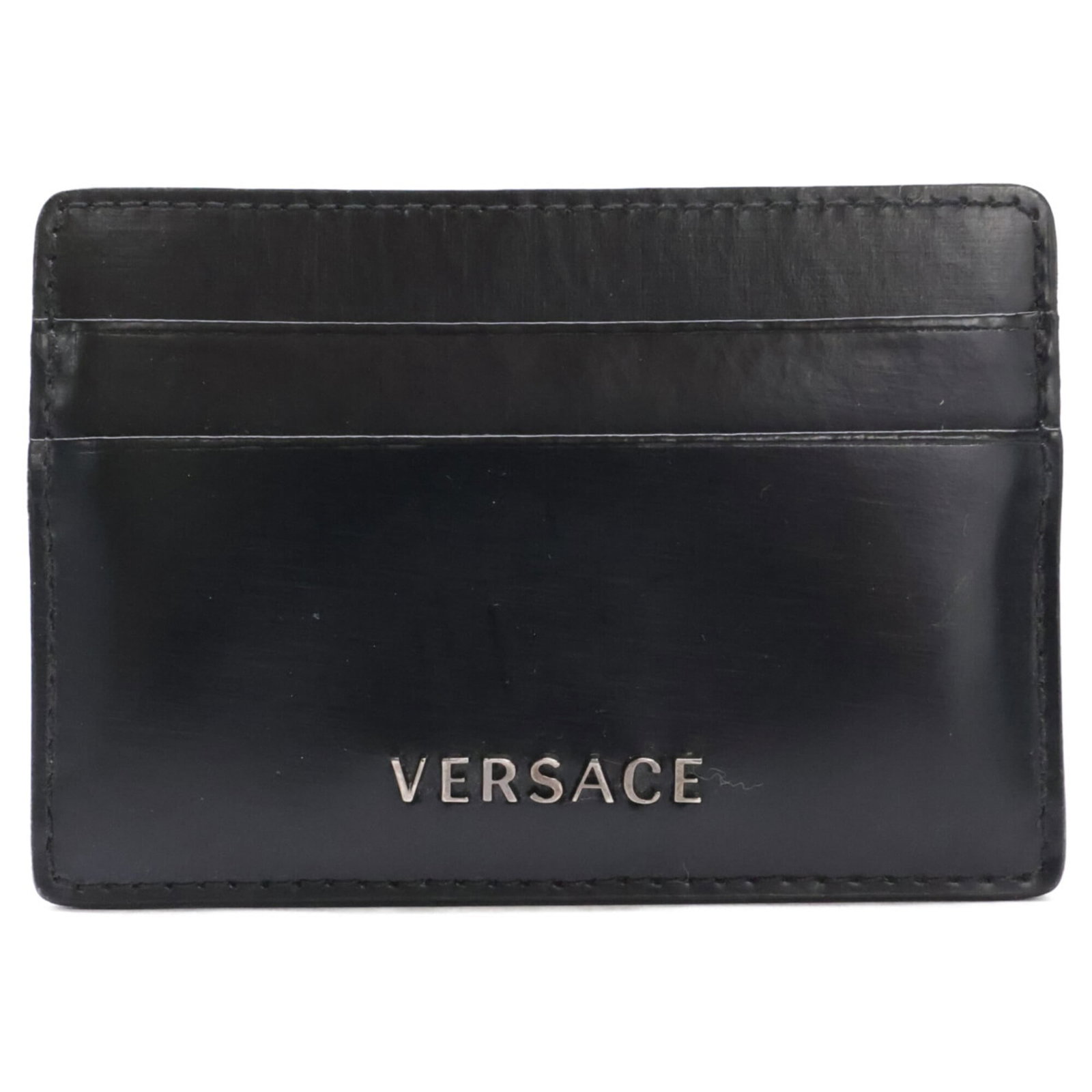 Business Card Case Versace: Business Card Case Versace Versace Business Card Case in Black. This sleek business card case measures 7cm x 10cm and features the iconic Versace brand, adding a touch of luxury to your daily essentia
