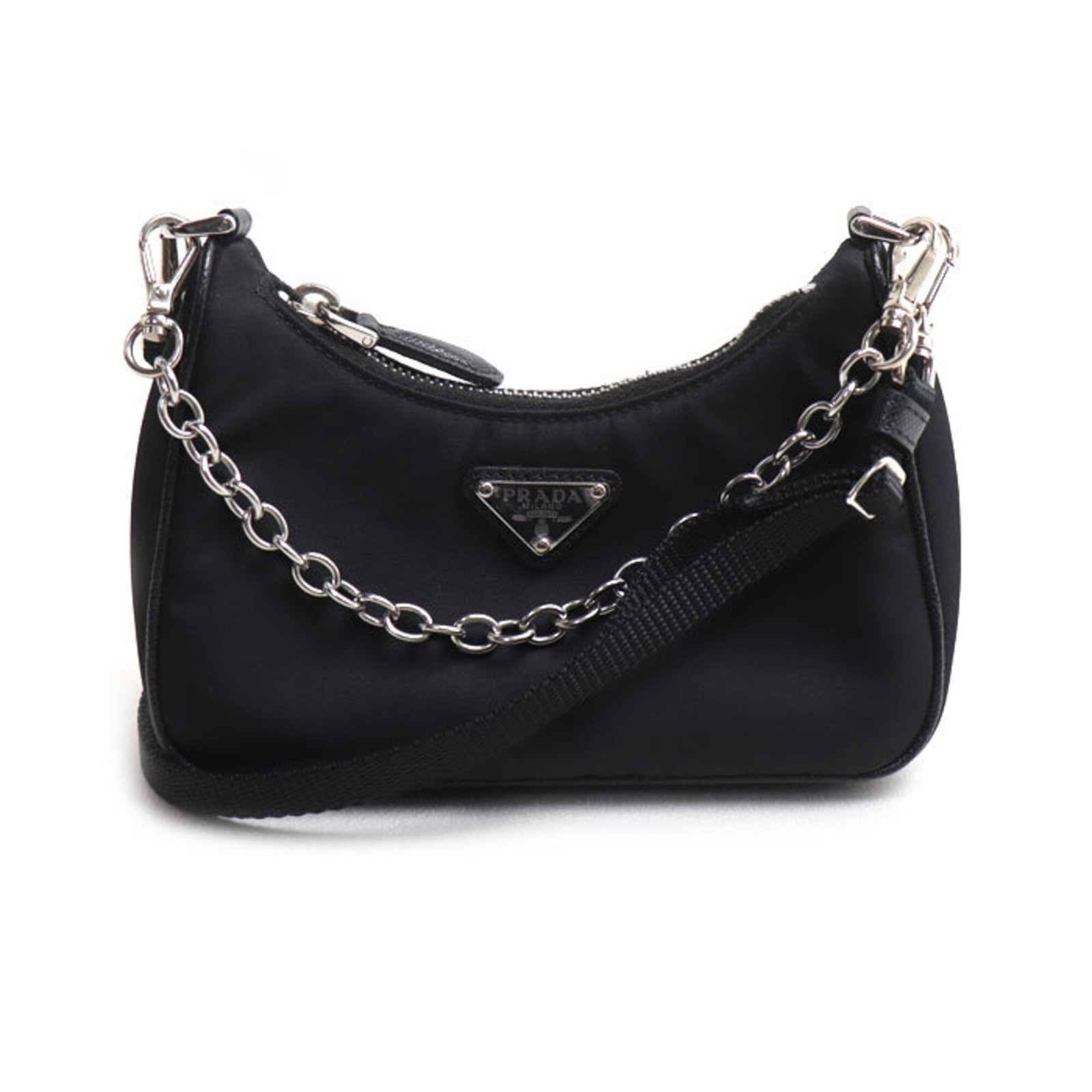 Prada Shoulder Bag Nylon: Prada Shoulder Bag Nylon Prada's nylon shoulder bag boasts sleek, modern design with its black and silver hardware. Made from durable nylon, the bag measures 7cm x 15cm x 4.5cm, providing a compact ye
