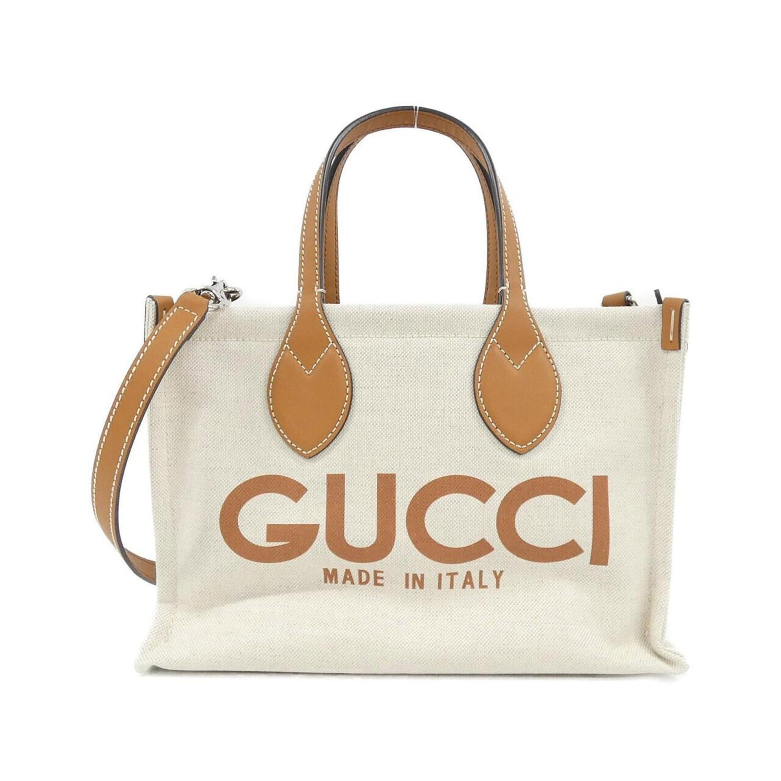 Cotton Handbag Leather Pouch Gucci: Cotton Handbag Leather Pouch Gucci Cotton Handbag Leather Pouch Gucci features a unique combination of materials, including cotton and leather, in a beige and light brown color scheme. The silver hard