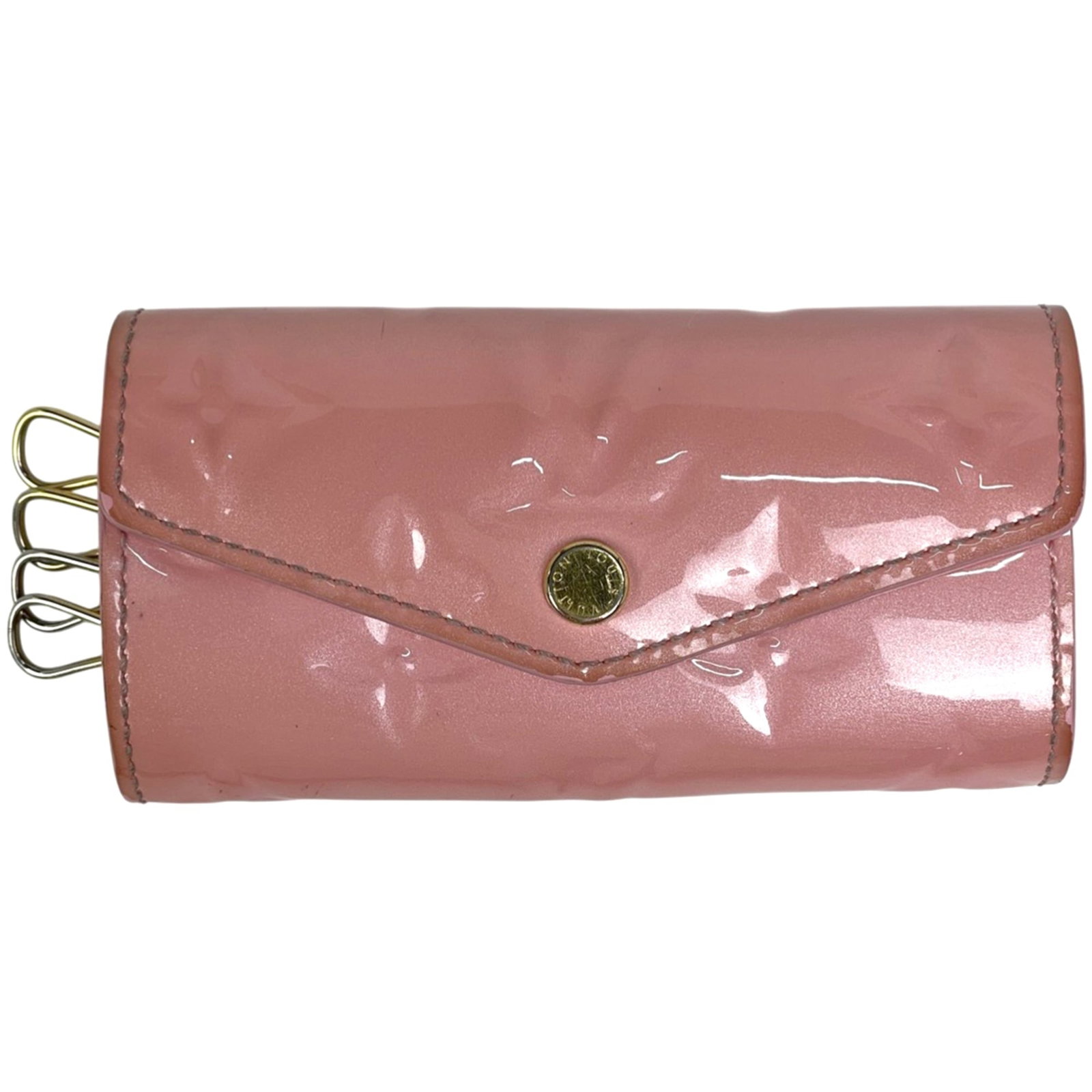 Keycase Monogram by Louis Vuitton Vernis: Keycase Monogram by Louis Vuitton Vernis The Louis Vuitton Vernis Keycase Monogram in pink features the iconic monogram pattern, adding a touch of elegance to your keys. Made from high-quality materia