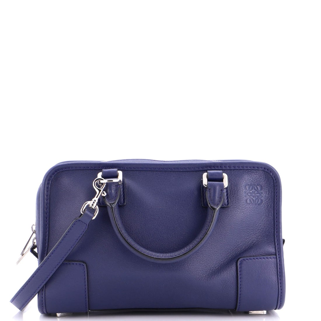 Loewe Amazona Bag Leather 23: Loewe Amazona Bag Leather 23 The Loewe Amazona Bag Leather 23 features a striking blue exterior with heavy corner wear, scuffs, and edge wear. This satchel boasts a classic design with a silver hardwa