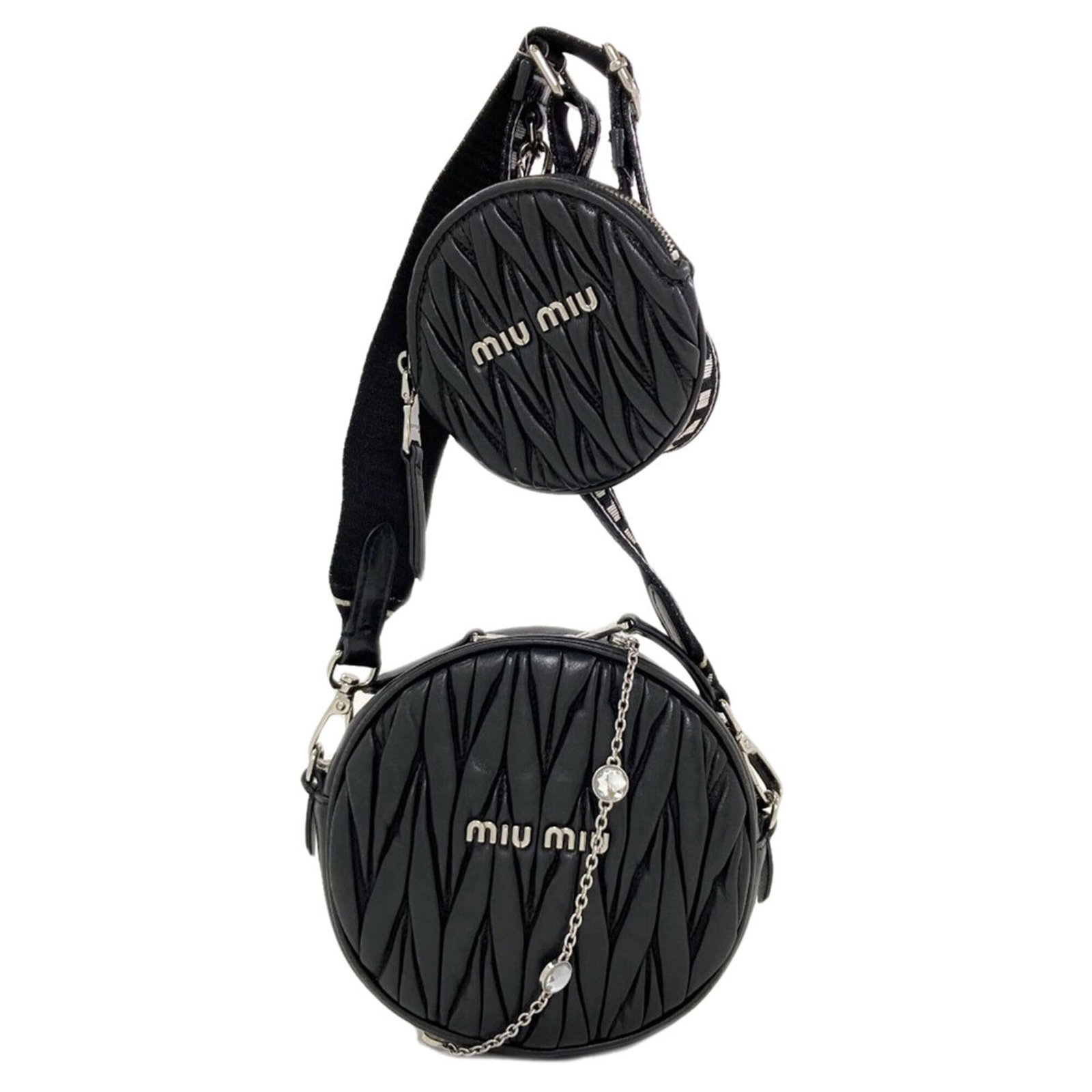 Shoulder bag leather pouch Miu: Shoulder bag leather pouch Miu Black leather shoulder bag with a sleek, compact design. Measuring just 15cm x 15cm x 5cm, it's perfect for carrying the essentials in style. Its understated black color